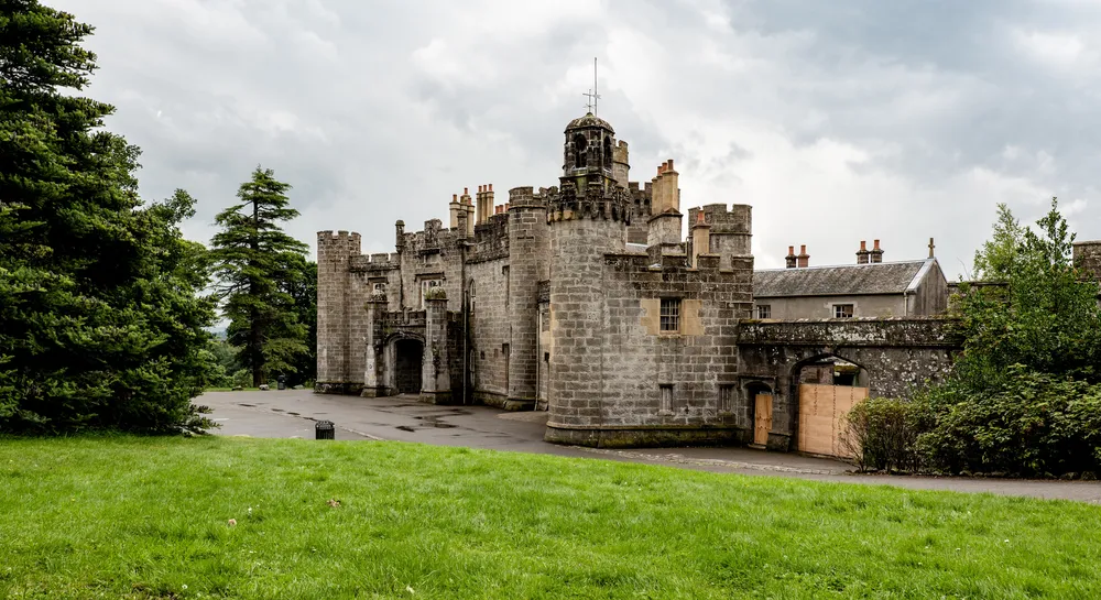 BALLOCH, SCOTLAND - AUGUST 1, 2019: The ancient Balloch Castle in Scotland, UK built on a hill in an early 19th century