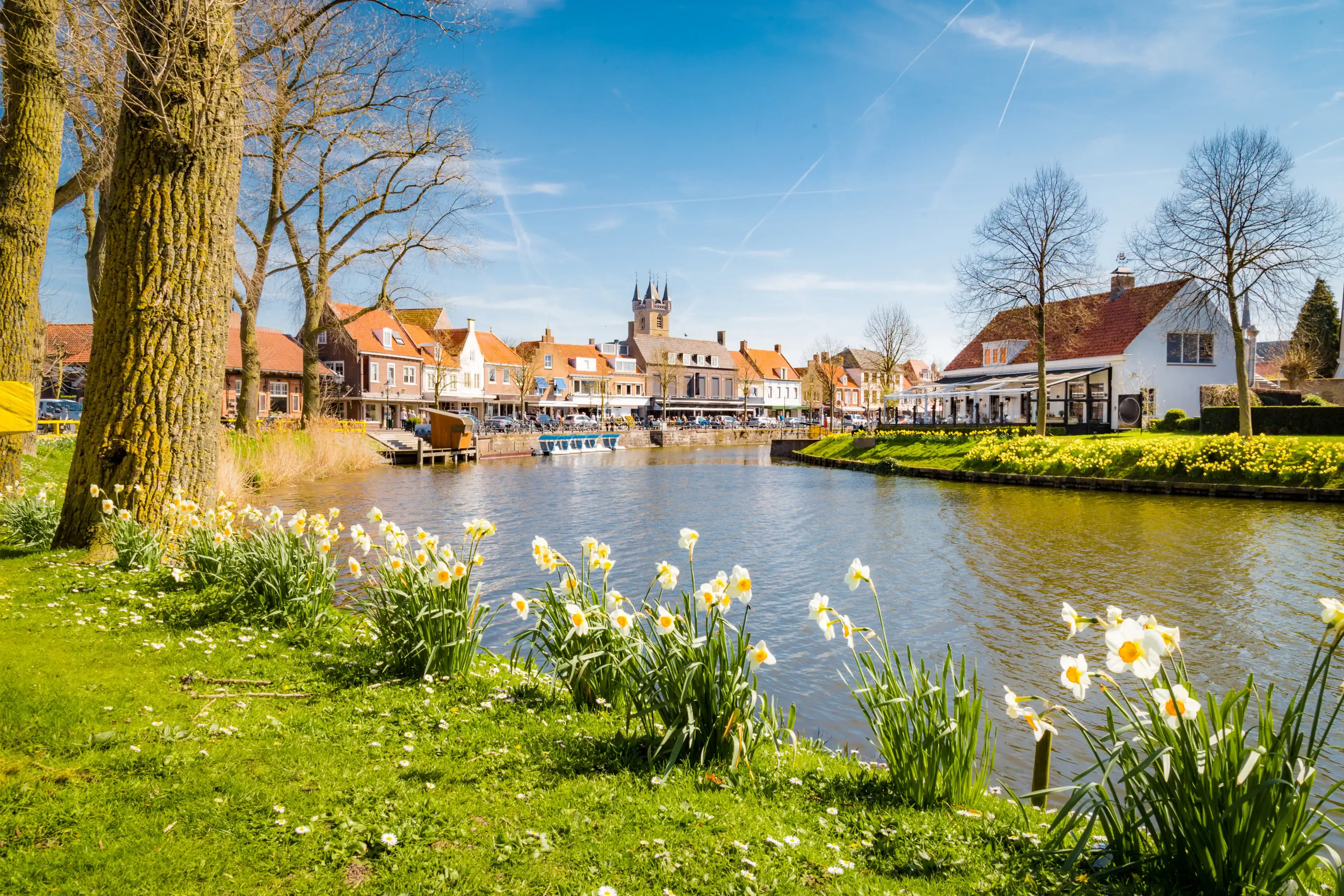Beautiful view of the historic town of Sluis on a scenic sunny day with blue sky and clouds in spring, Zeelandic Flanders region, Netherlands Beautiful view of the historic town of Sluis on a scenic sunny day with blue sky and clouds in spring, Zeelandic Flanders region, Netherlands