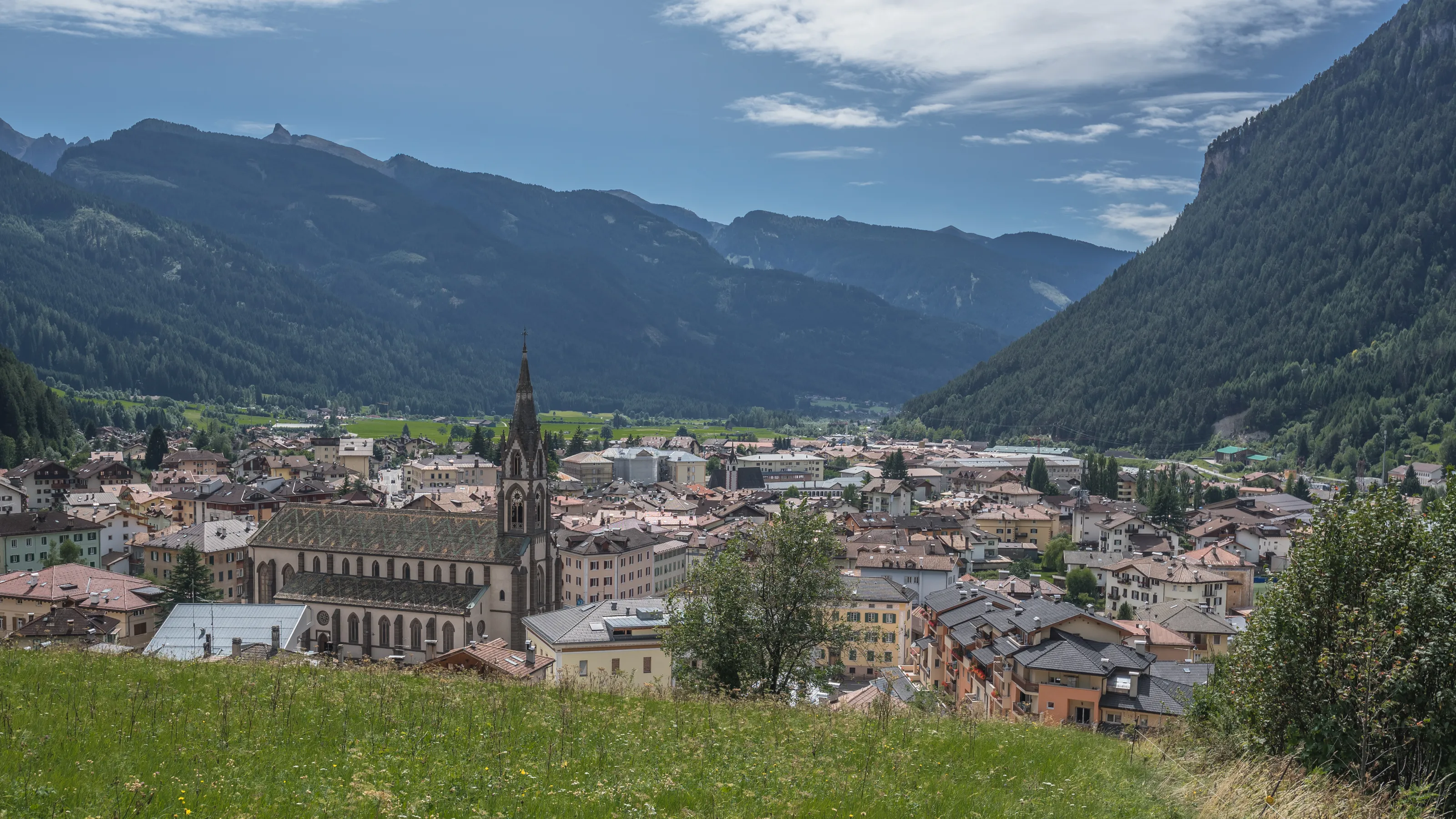 View of Predazzo village & Val di Fiemme [valley] as seen from Bosca Fontana forest, from eastern side of the village, Latemar mountain group, Dolomites, Trento, Trentino, South Tyrol, Italy