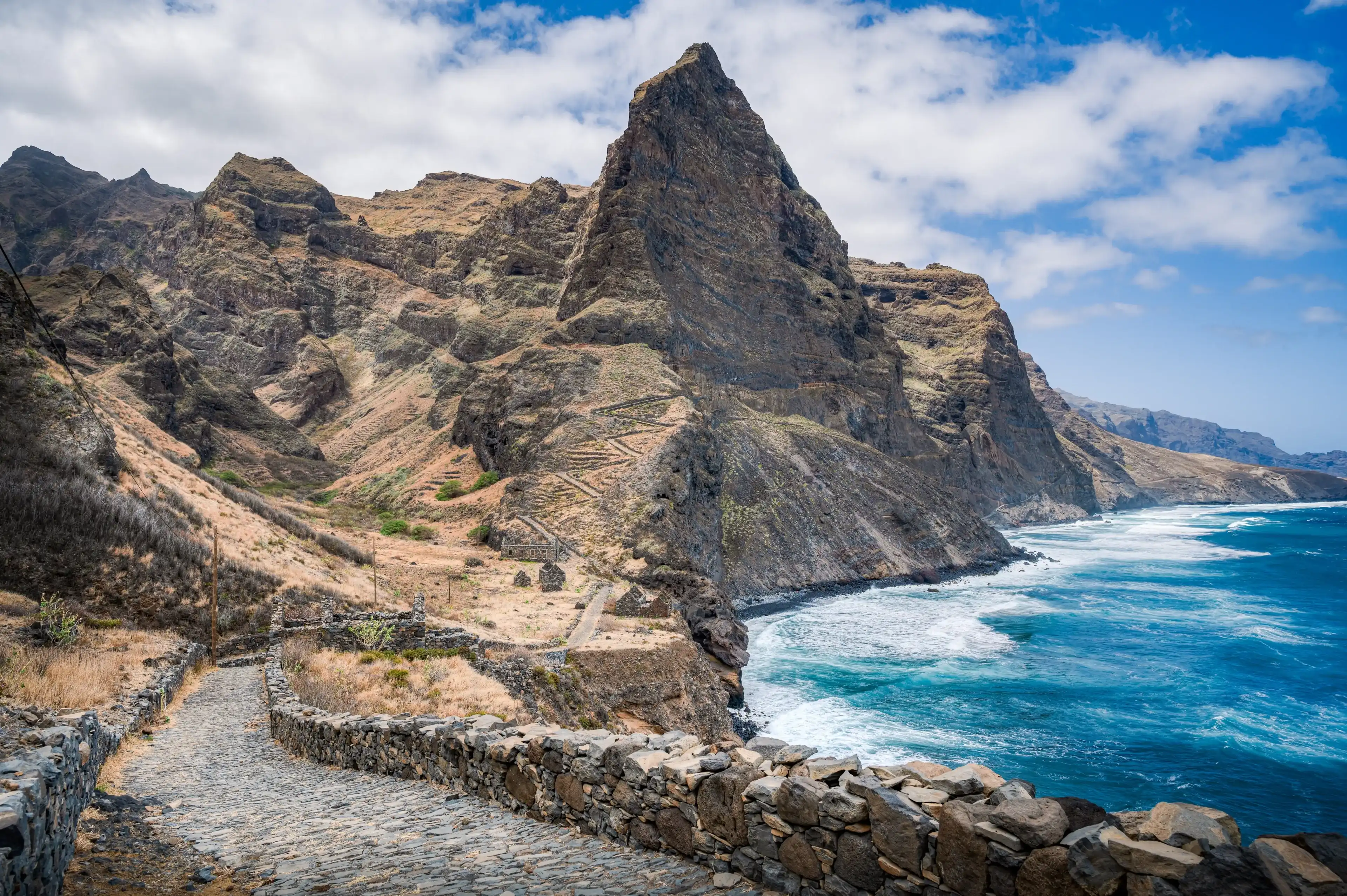 Cobblestone path along the coast on Santo Antao, trekking from village to another,ruins of Aranhas, Cabo verde Cobblestone path along the coast on Santo Antao, trekking from village to another,ruins of Aranhas, Cabo verde