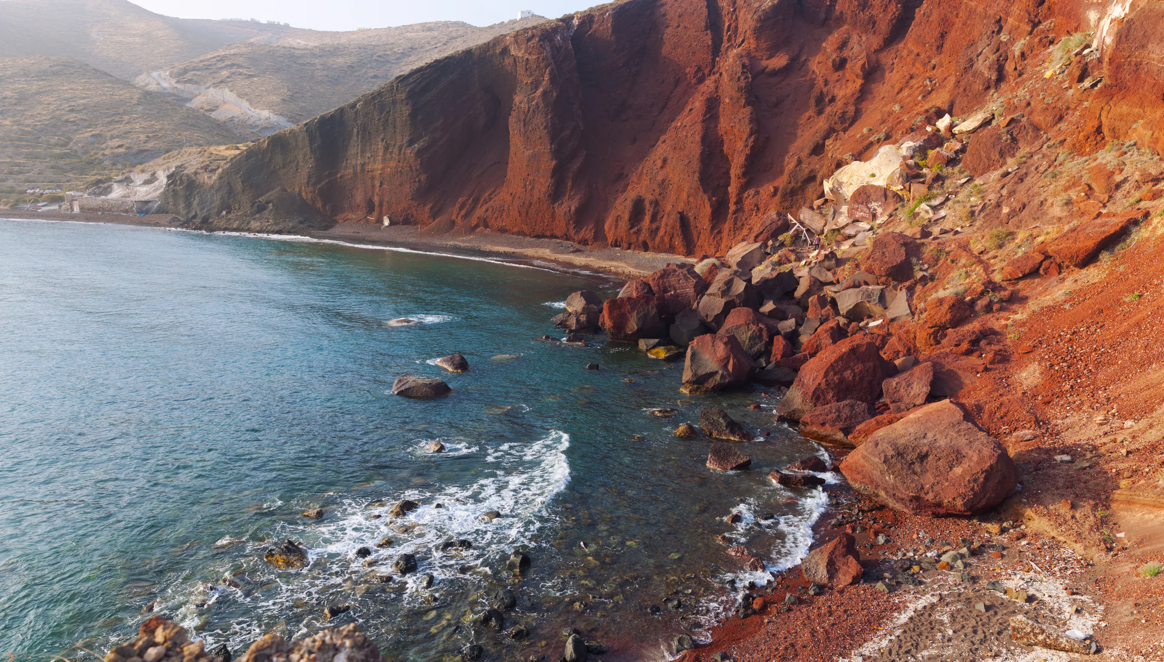 Beautiful scenery of red sand beach in Akrotiri village, Santorini, Greece.
