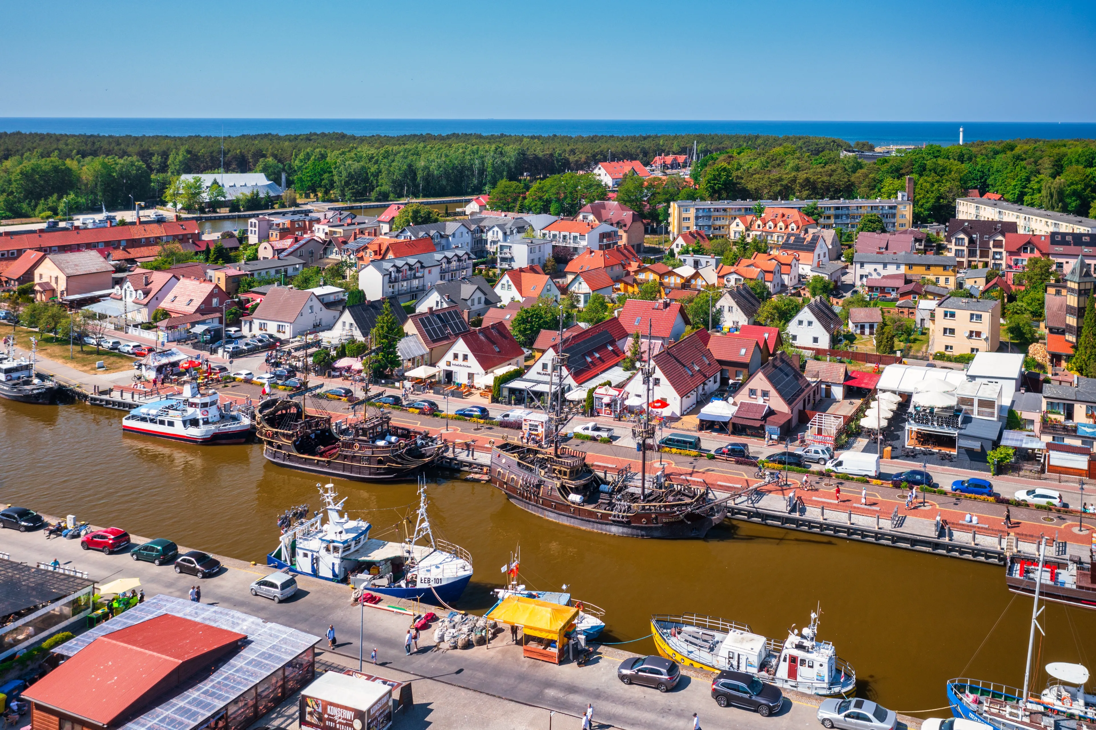 Leba, Poland - June 8, 2023: Ships in the port of Leba town by the Baltic Sea, Poland. Leba is a popular tourist destination by the Baltic Sea in Poland.
