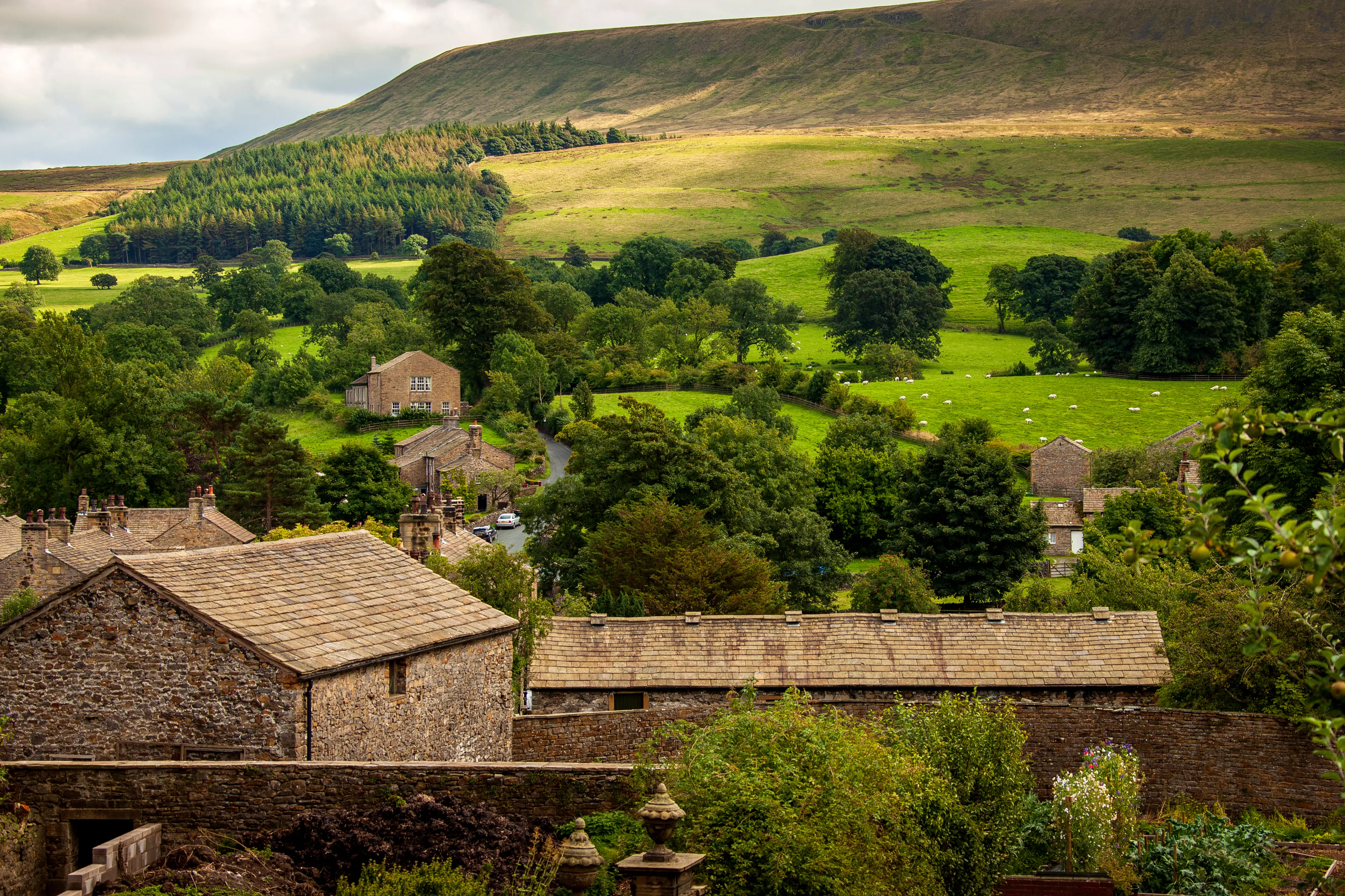 With ancient stone cottages, lush farmland and thick forests, Downham village near Clitheroe, is one of the most beautiful villages in Lancashire, England.