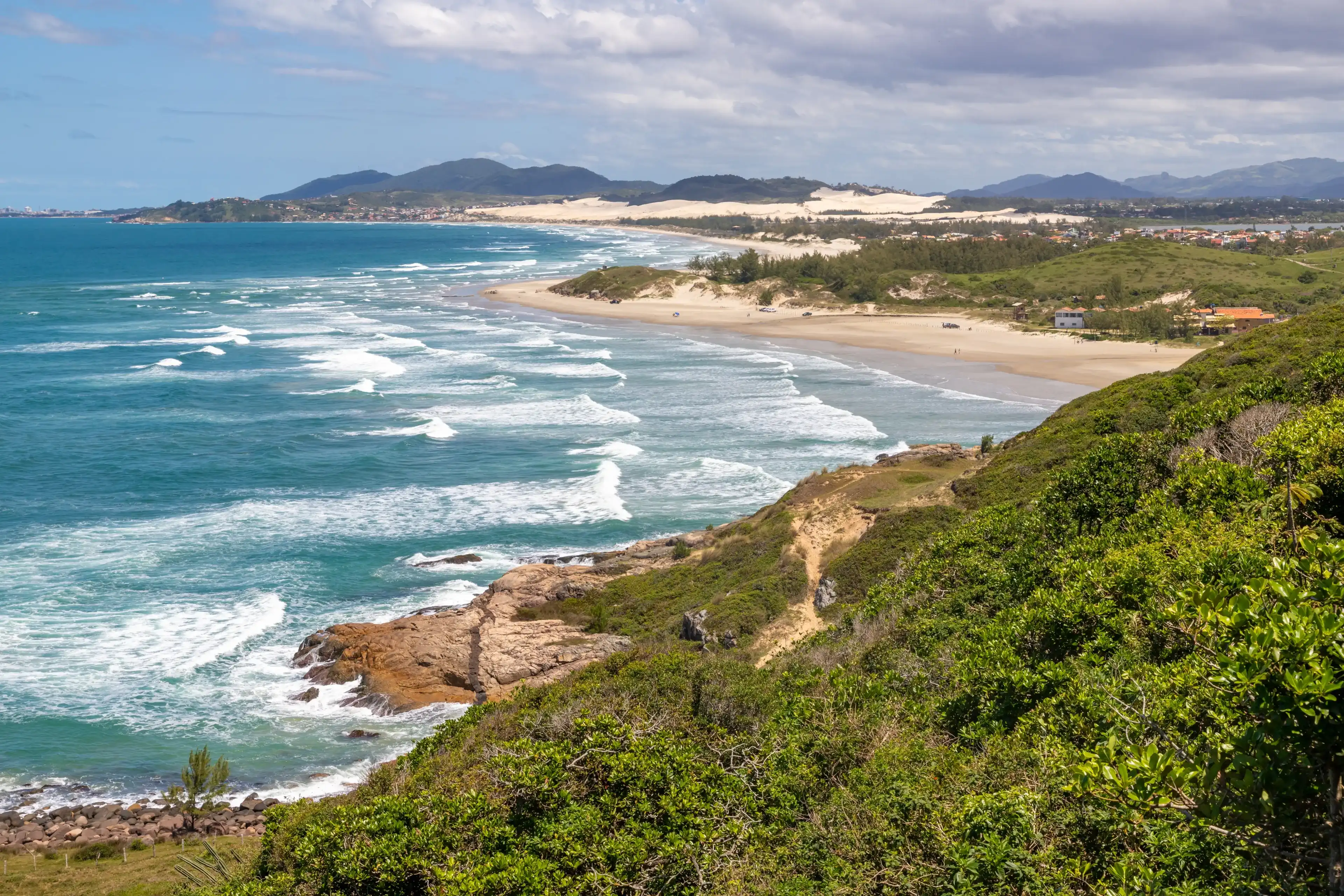 Trail to the beach with vegetation, rocks and mountain, Barra do Ibiraquera , Ibiraquera, Santa Catarina, Brazil Trail to the beach with vegetation, rocks and mountain, Barra do Ibiraquera , Ibiraquera, Santa Catarina, Brazil