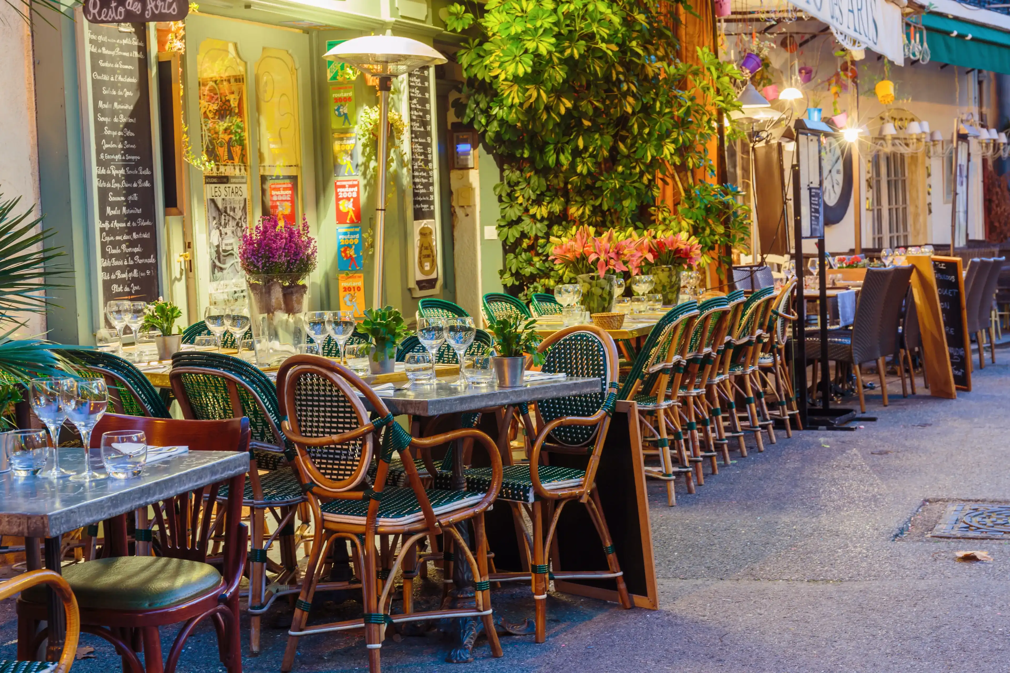 MOUGINS, FRANCE - OCTOBER 31, 2014: Street cafe at night MOUGINS, FRANCE - OCTOBER 31, 2014: Street cafe at night