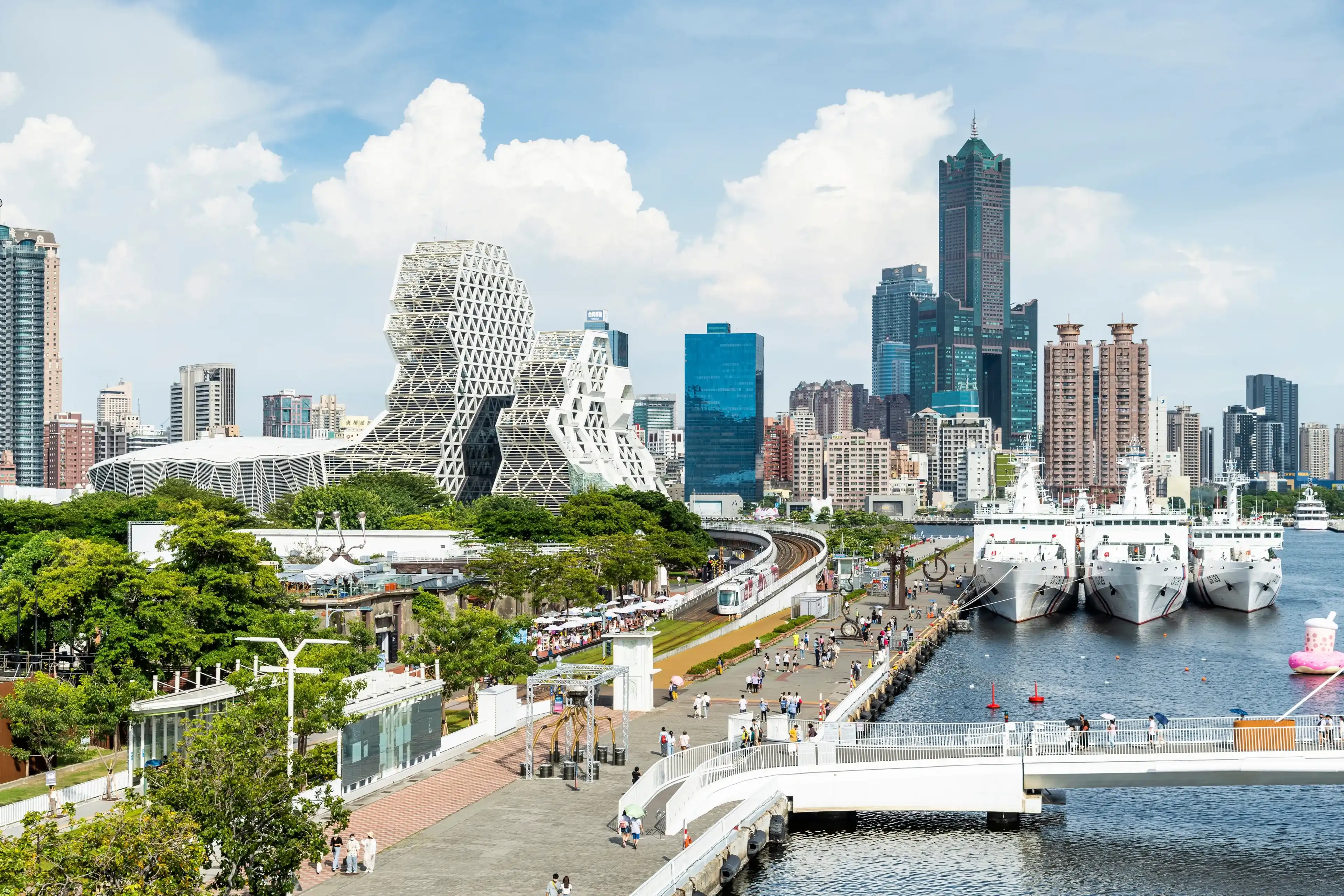 Kaohsiung, Taiwan- August 27, 2022: Overlooking view of the Pier-2 Art Center with the famous landmark 85 Sky Tower and Kaohsiung Music Center in the port of Kaohsiung, Taiwan. Kaohsiung, Taiwan- August 27, 2022: Overlooking view of the Pier-2 Art Center with the famous landmark 85 Sky Tower and Kaohsiung Music Center in the port of Kaohsiung, Taiwan.