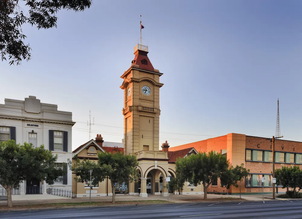 Town hall facade facing street with tall clock tower at sunrise in a small regional town Mildura, of Australia.