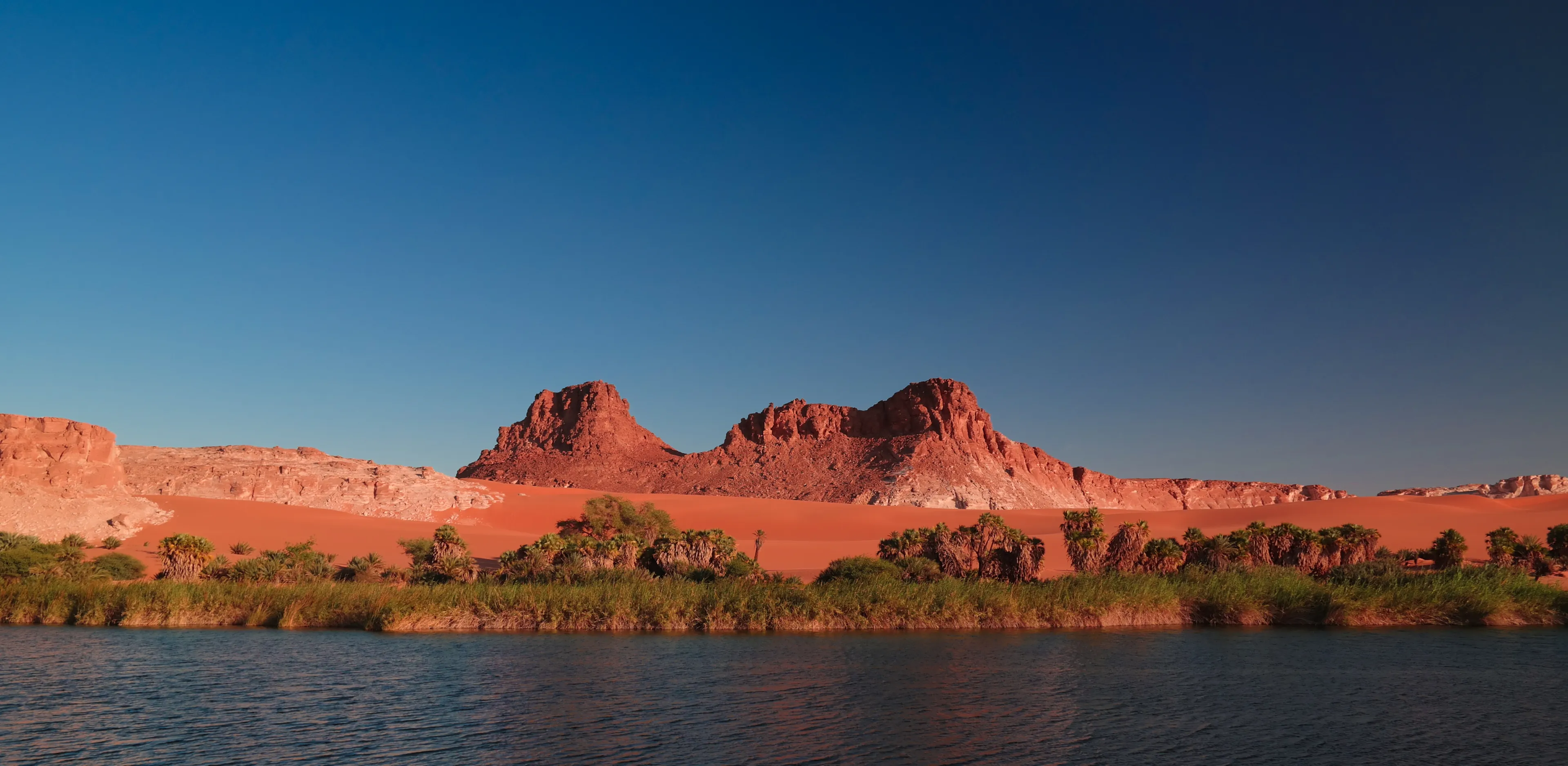 Panoramic view to Boukkou lake group of Ounianga Serir lakes at sunset , Ennedi, Chad