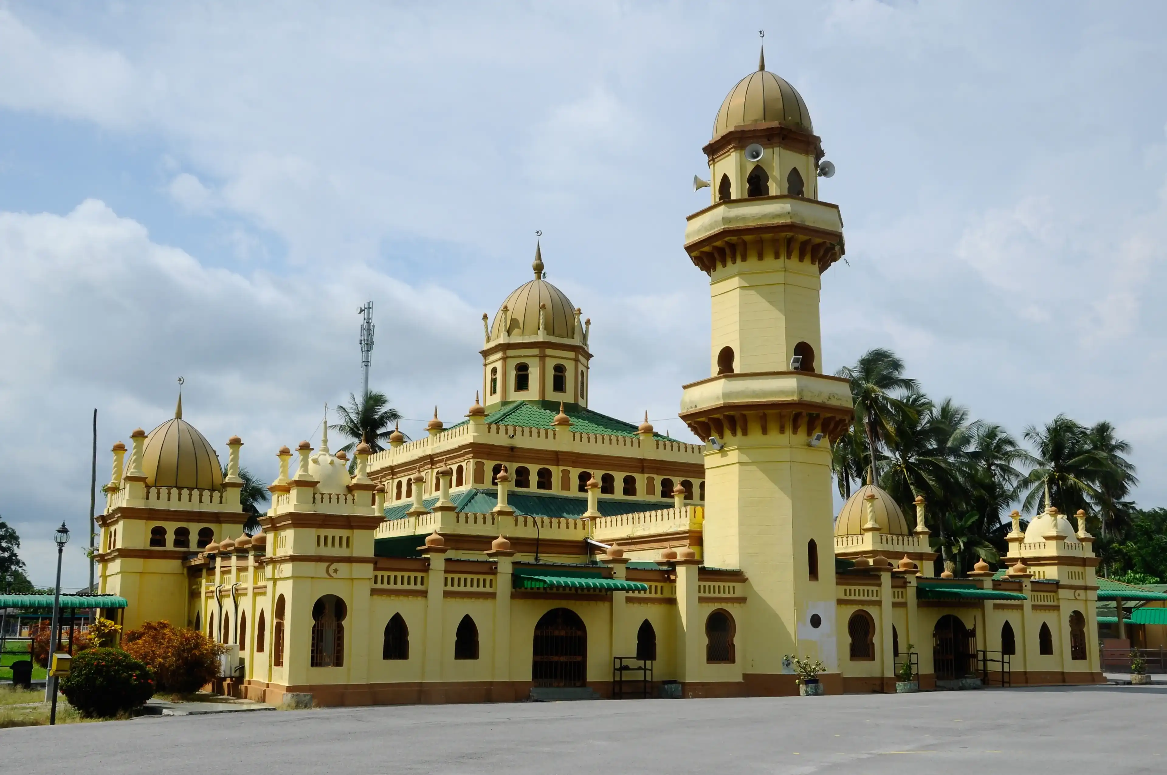 SELANGOR, MALAYSIA - NOVEMBER 28, 2013: Sultan Alaeddin Mosque in Banting, Selangor, Malaysia. It was built in the year 1932 with influence by a Moorish architecture that still stands strong today. SELANGOR, MALAYSIA - NOVEMBER 28, 2013: Sultan Alaeddin Mosque in Banting, Selangor, Malaysia. It was built in the year 1932 with influence by a Moorish architecture that still stands strong today.