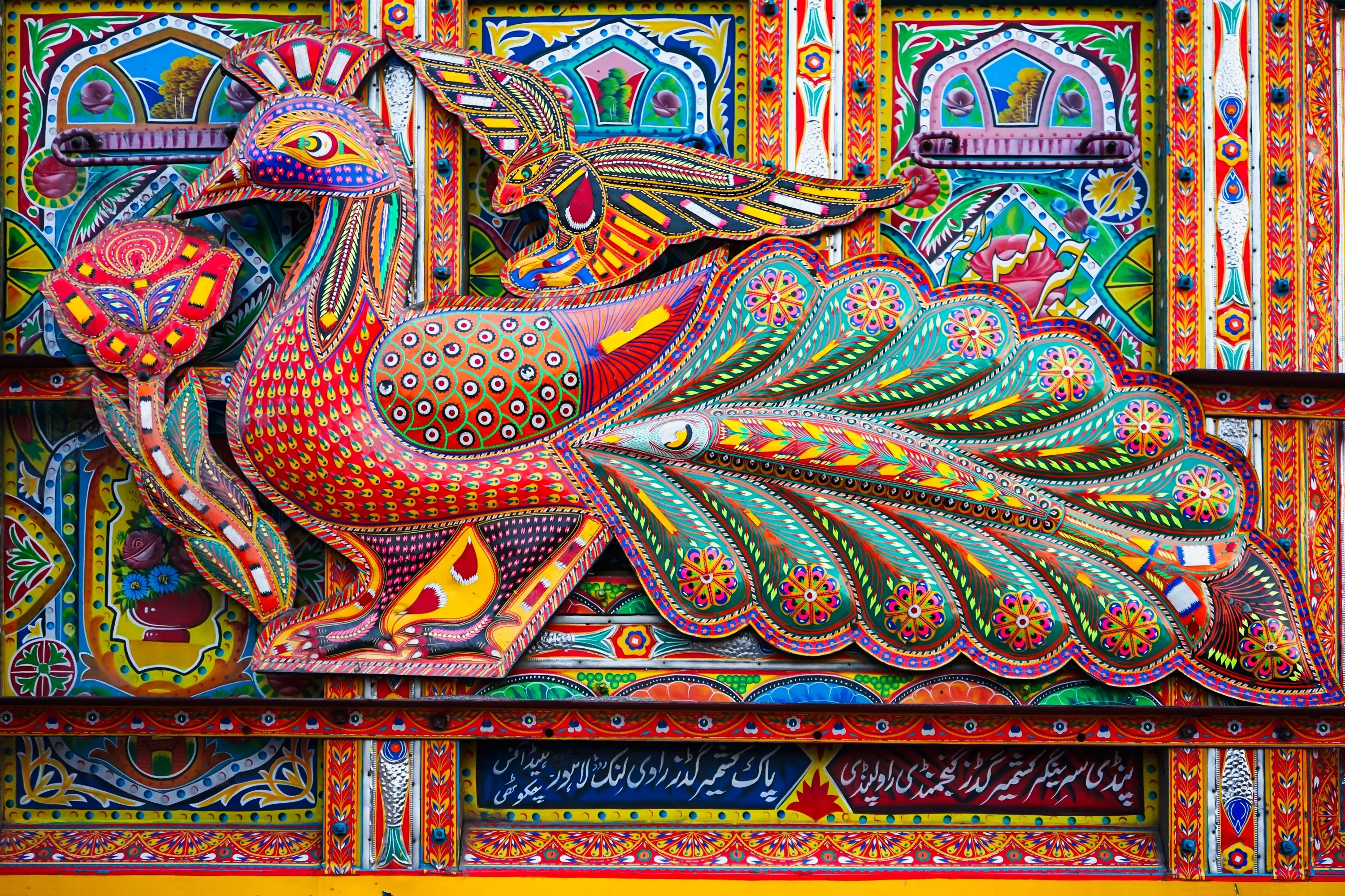 Peshawar, Khyber Pakhtunkhwa, Pakistan - May 23 2023: Close-up detail of Pakistani truck art at a workshop yard outside Peshawar.