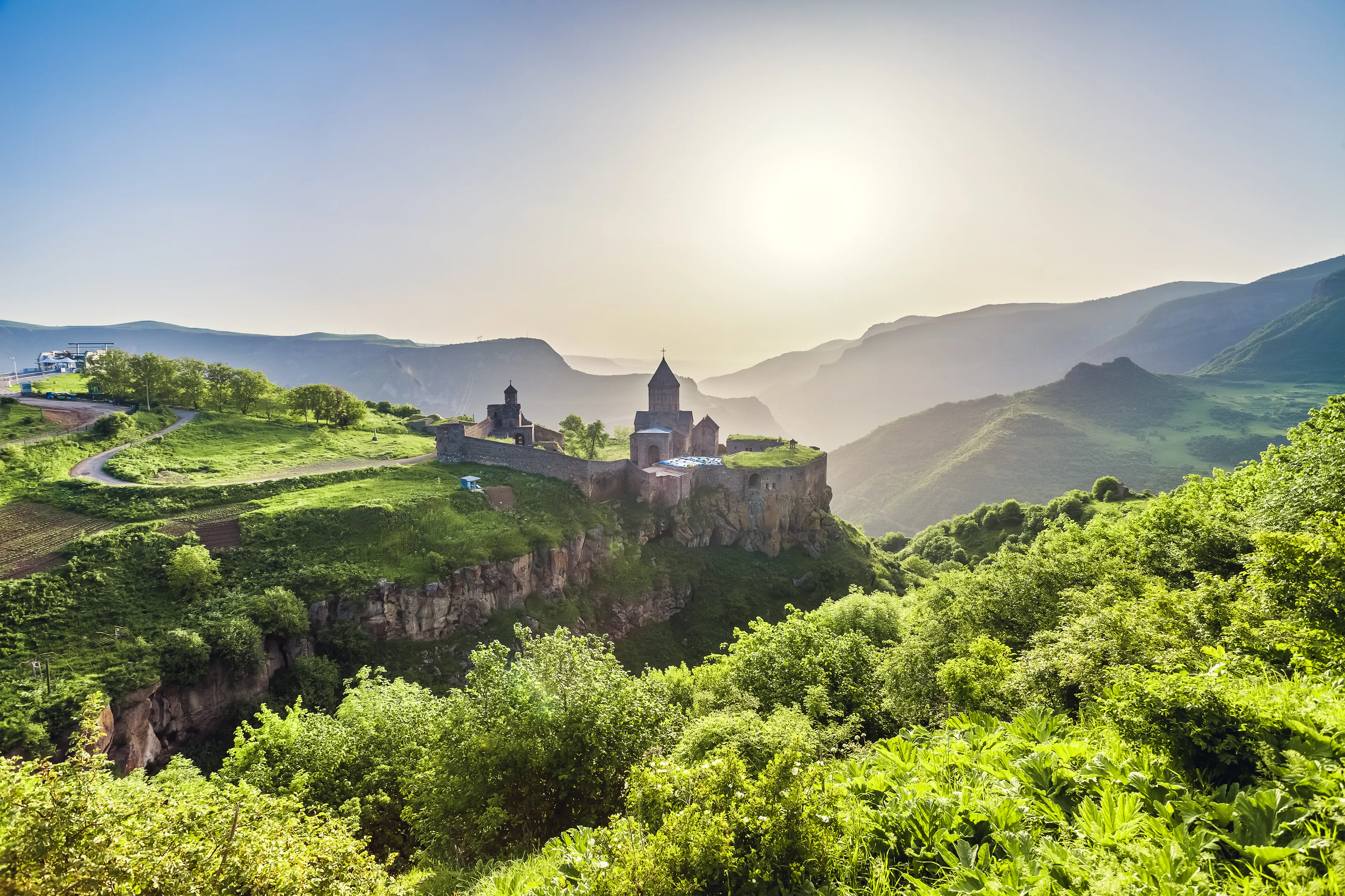Ancient monastery in setting sun. Tatev. Armenia
