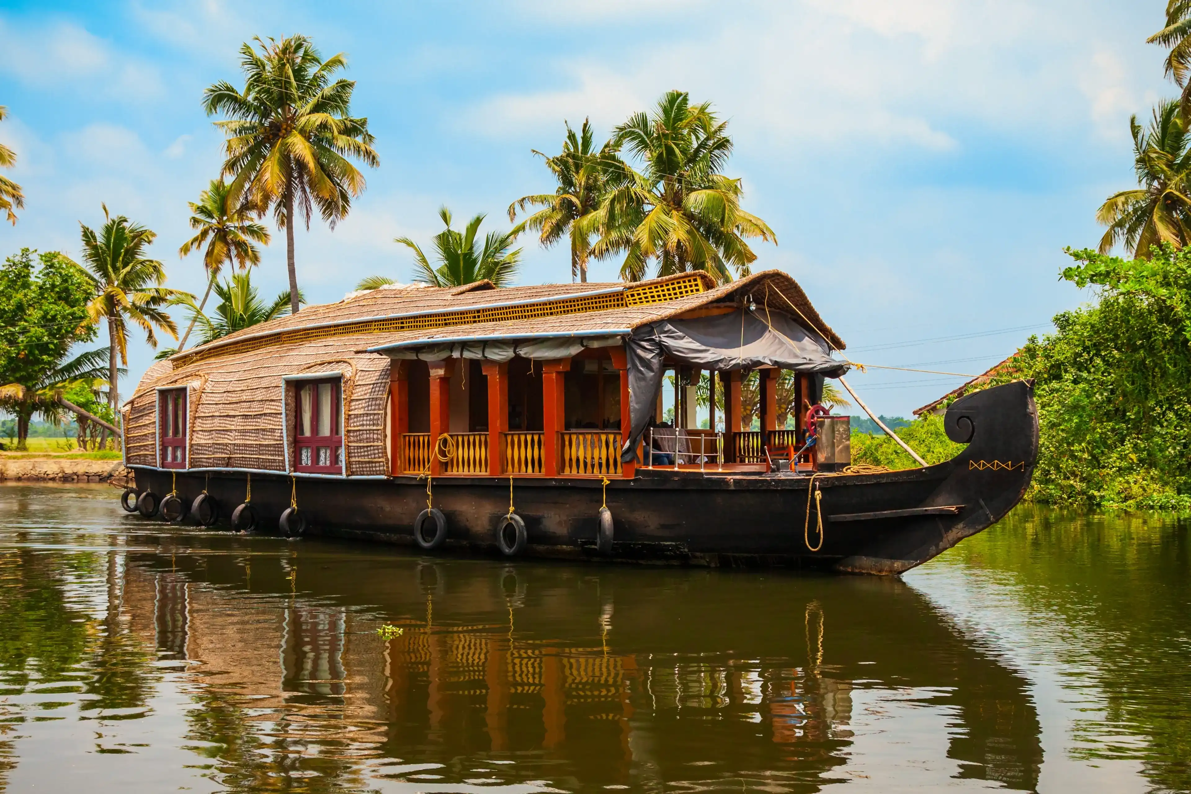 A houseboat sailing in Alappuzha backwaters in Kerala state in India A houseboat sailing in Alappuzha backwaters in Kerala state in India