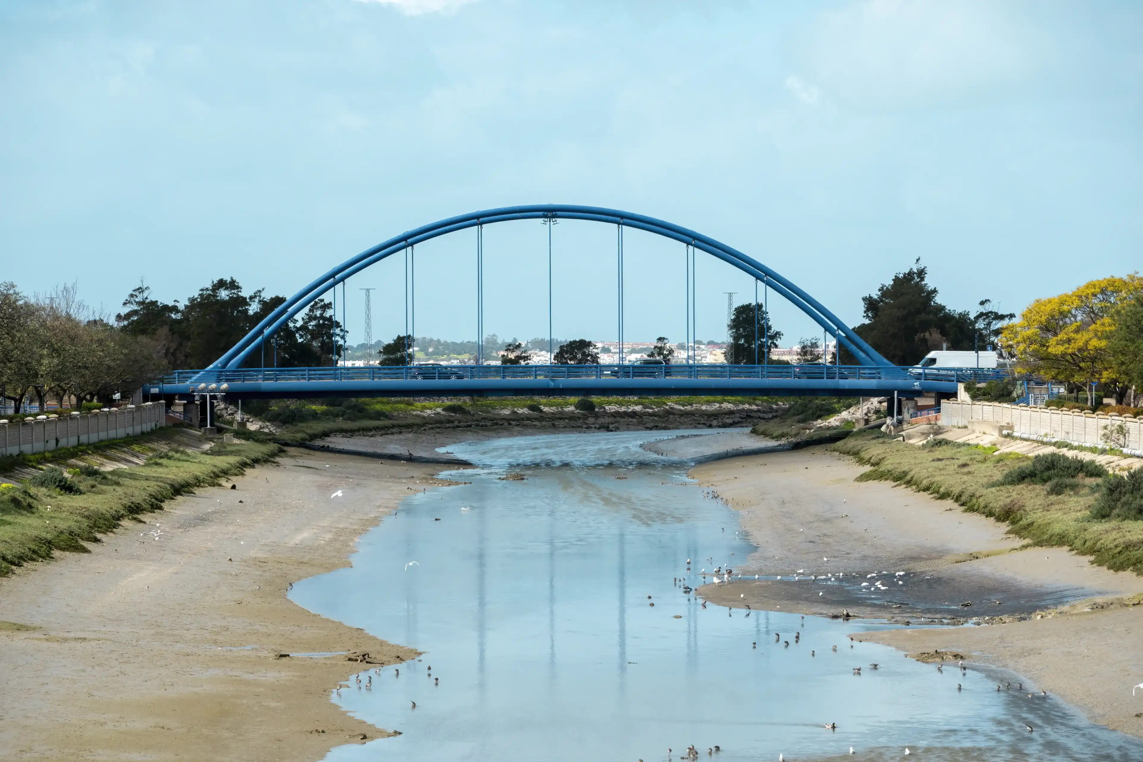 Chiclana de la Frontera, Cadiz, Spain - February 26, 2024: View of the Customs building in Cadiz, Spain.Landscape with the so-called Blue Bridge over the Iro river with little water in Chiclana de la Chiclana de la Frontera, Cadiz, Spain - February 26, 2024: View of the Customs building in Cadiz, Spain.Landscape with the so-called Blue Bridge over the Iro river with little water in Chiclana de la