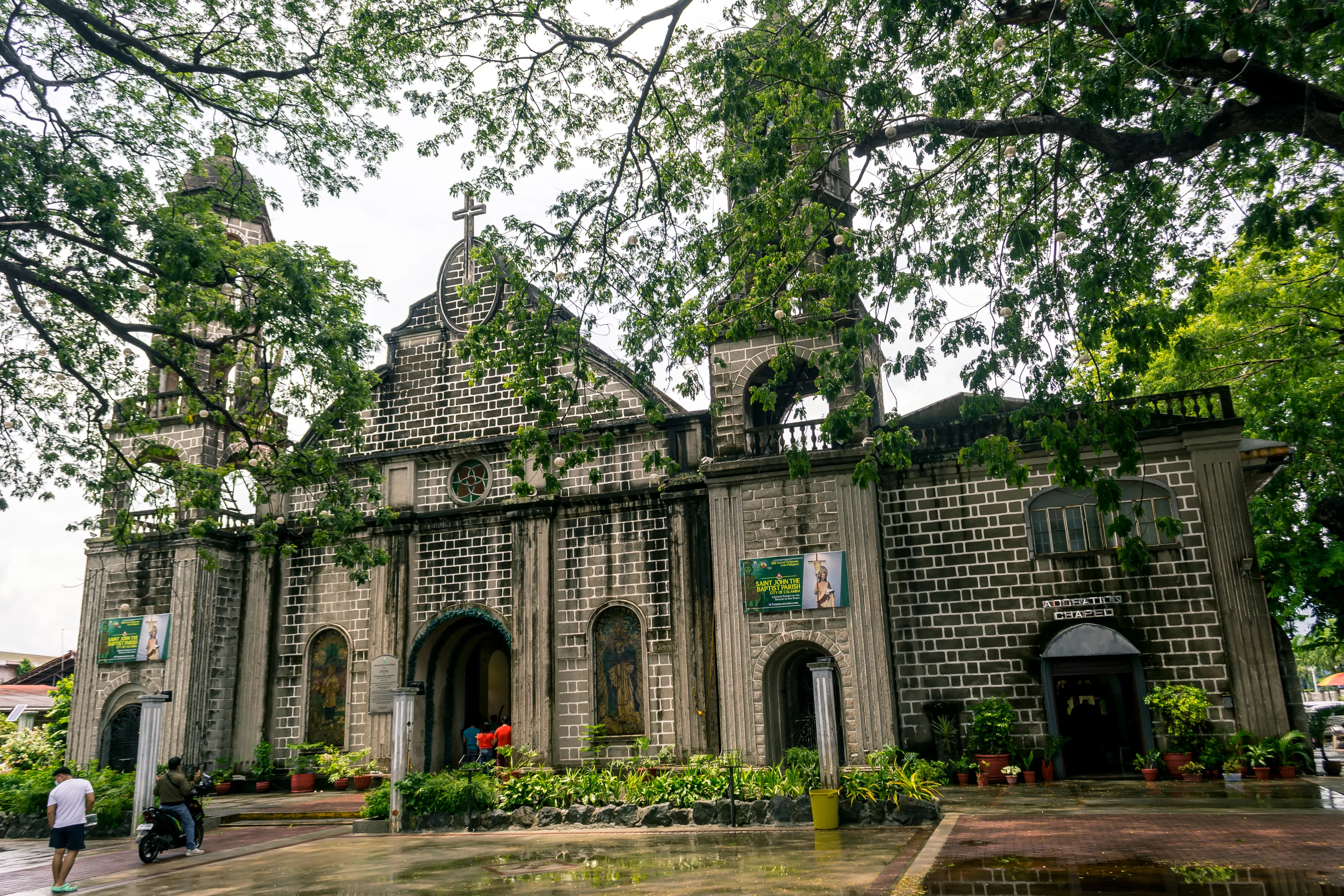 Calamba, Laguna, Philippines - June 2021: Saint John the Baptist Parish Church, a stone Roman Catholic Church of Baroque style architecture.
