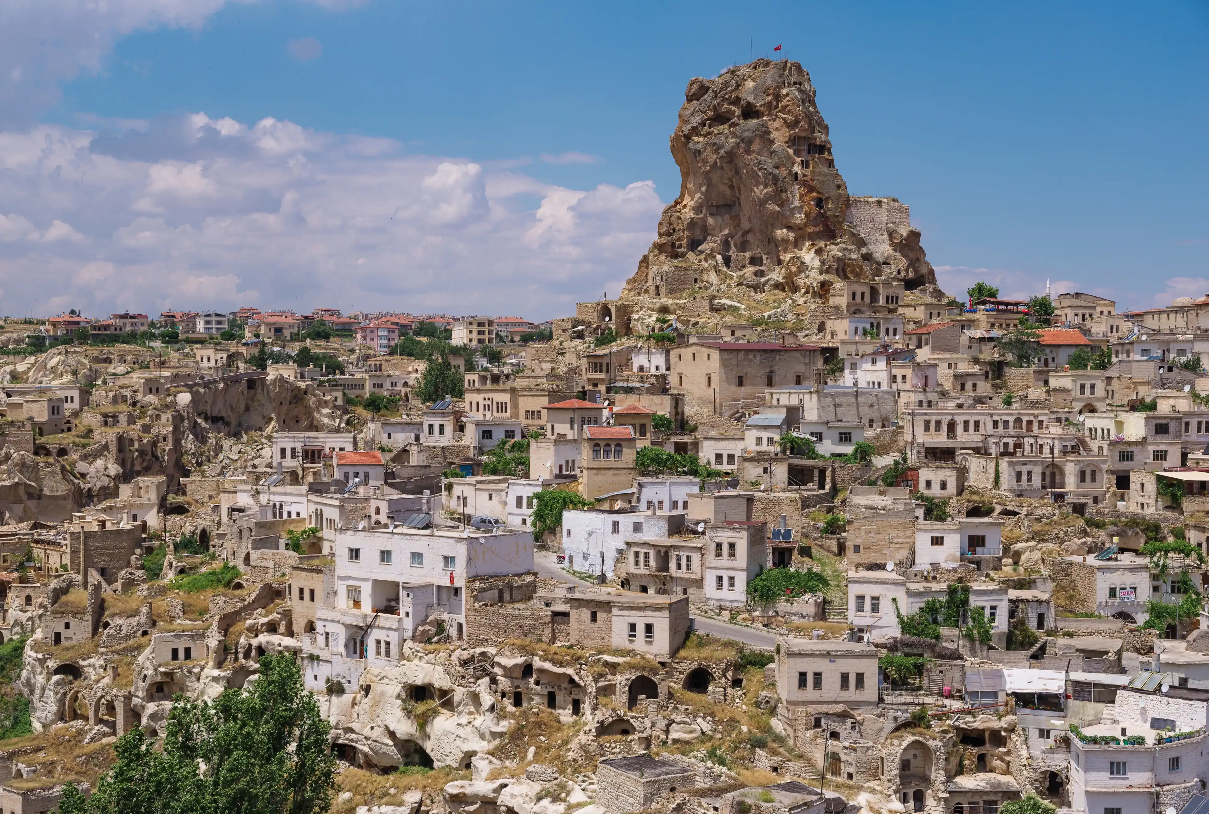 View of Ortahisar town old houses in rock formations from Ortahisar Castle. Cappadocia. Nevsehir Province. Turkey View of Ortahisar town old houses in rock formations from Ortahisar Castle. Cappadocia. Nevsehir Province. Turkey