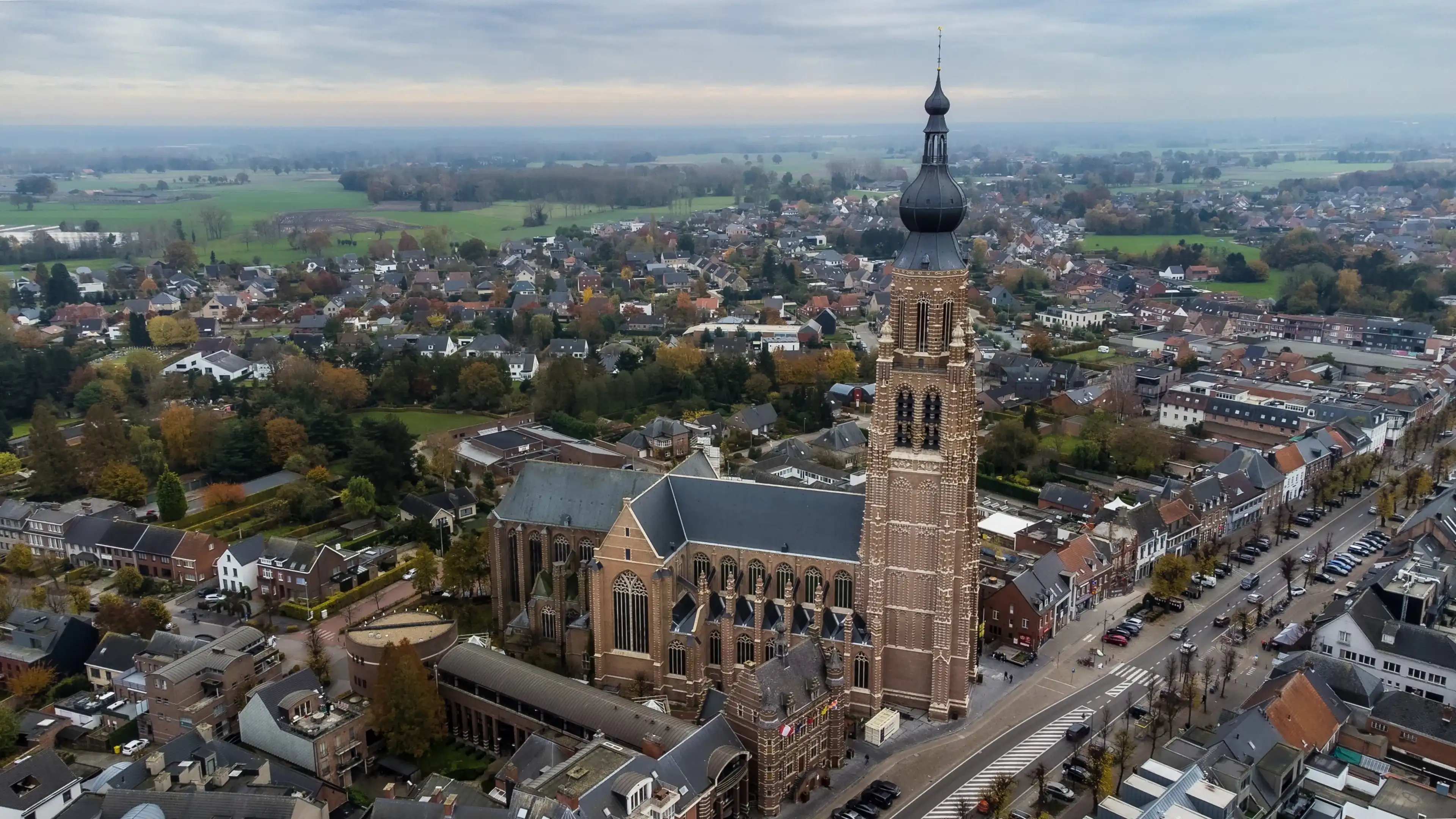 Belgium, Hoogstraten, 11 november 2021, Aerial drone photo of the late Gothic Saint-Katharina church, the third highest Belgium church, one of the world's tallest brick buildings. High quality photo Belgium, Hoogstraten, 11 november 2021, Aerial drone photo of the late Gothic Saint-Katharina church, the third highest Belgium church, one of the world's tallest brick buildings. High quality photo