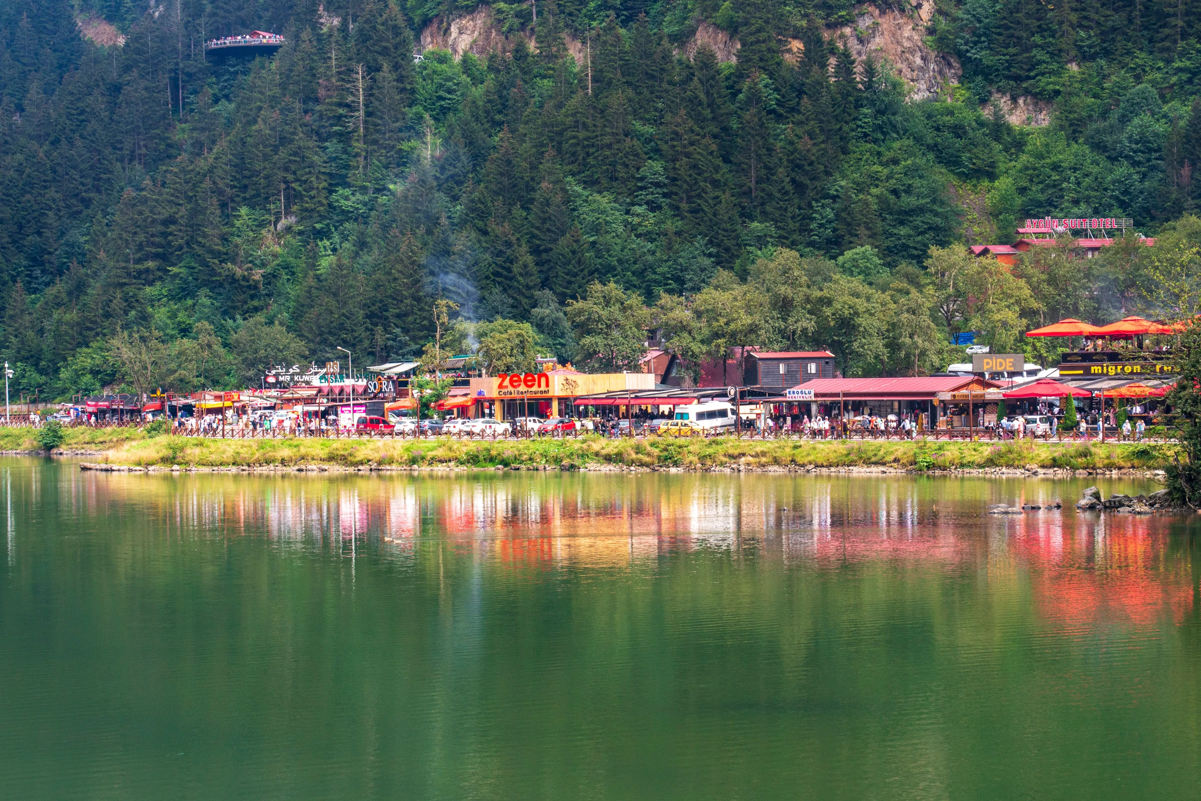 August 9 2021 Uzungol, Famous touristic lake with foggy green mountain and village in Caykara, Trabzon, Turkey. Natural beauty long lake ( uzun gol )