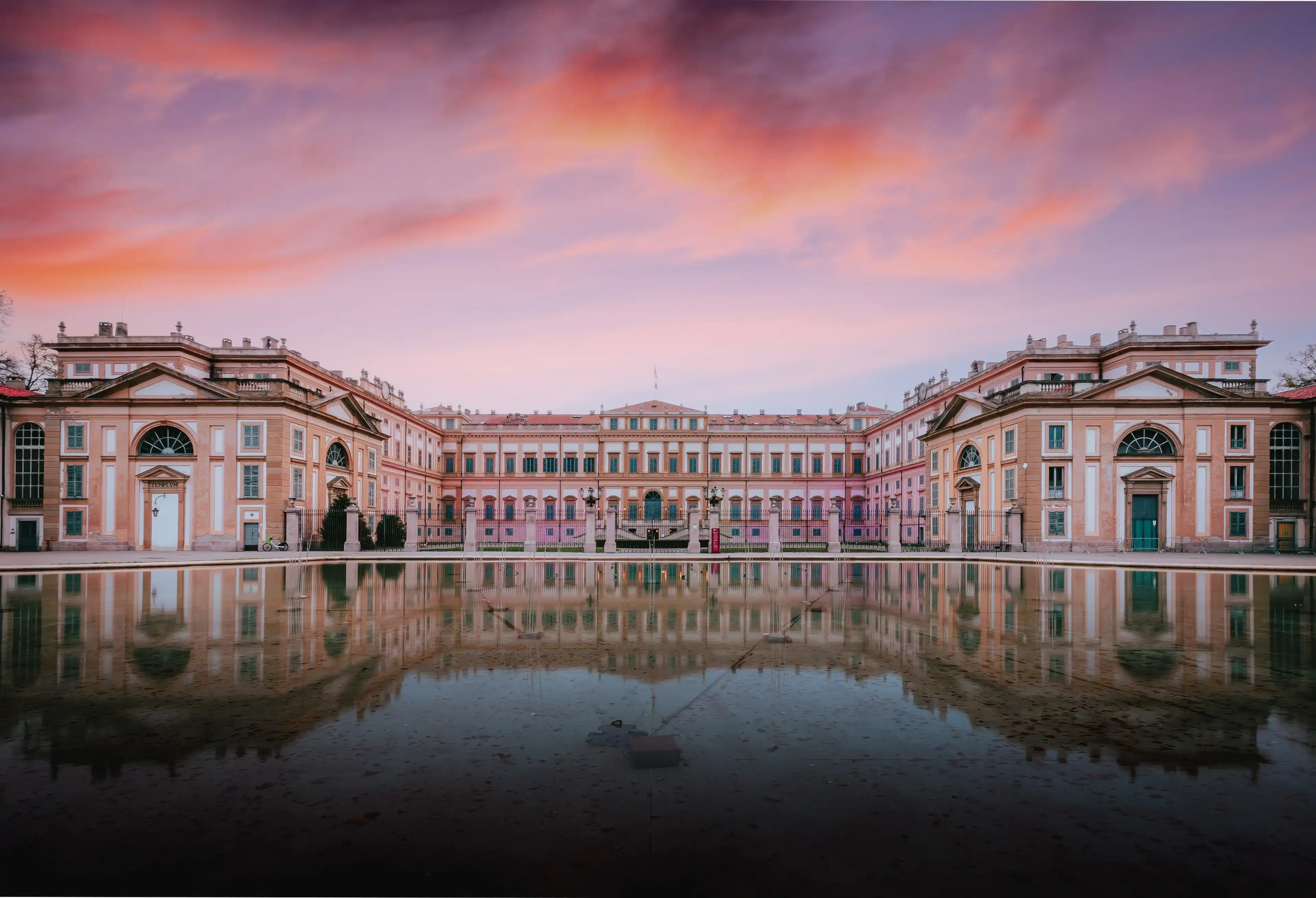 Monza, Italy - November 12, 2023: Villa Reale in Monza in neoclassical style at sunrise with reflection on water Monza, Italy - November 12, 2023: Villa Reale in Monza in neoclassical style at sunrise with reflection on water