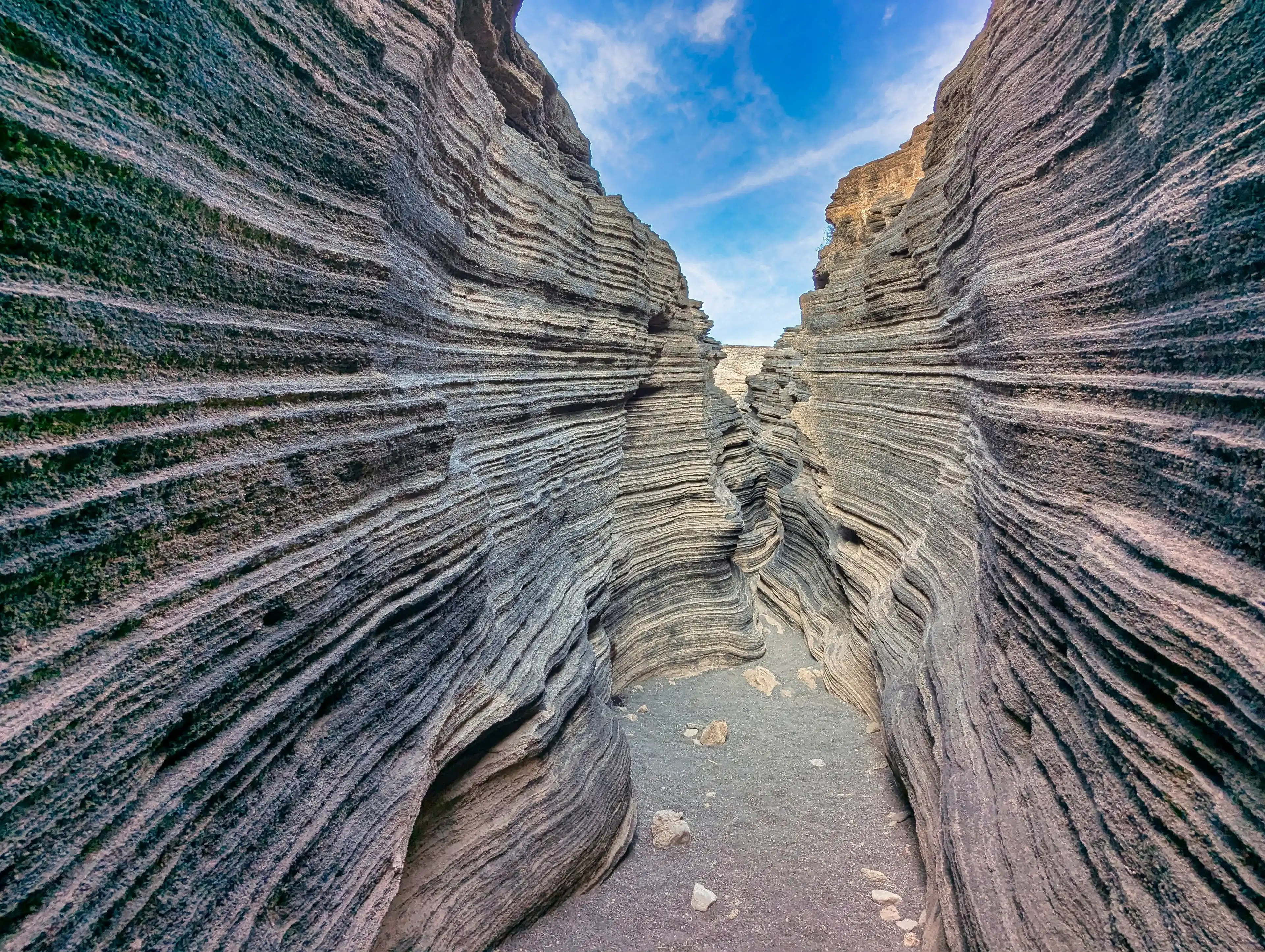 The broad volcanic gorge. The Cracks ( Las Grietas ). The slope of the Montana Blanca volcano. Lanzarote, Canary Islands, Spain The broad volcanic gorge. The Cracks ( Las Grietas ). The slope of the Montana Blanca volcano. Lanzarote, Canary Islands, Spain