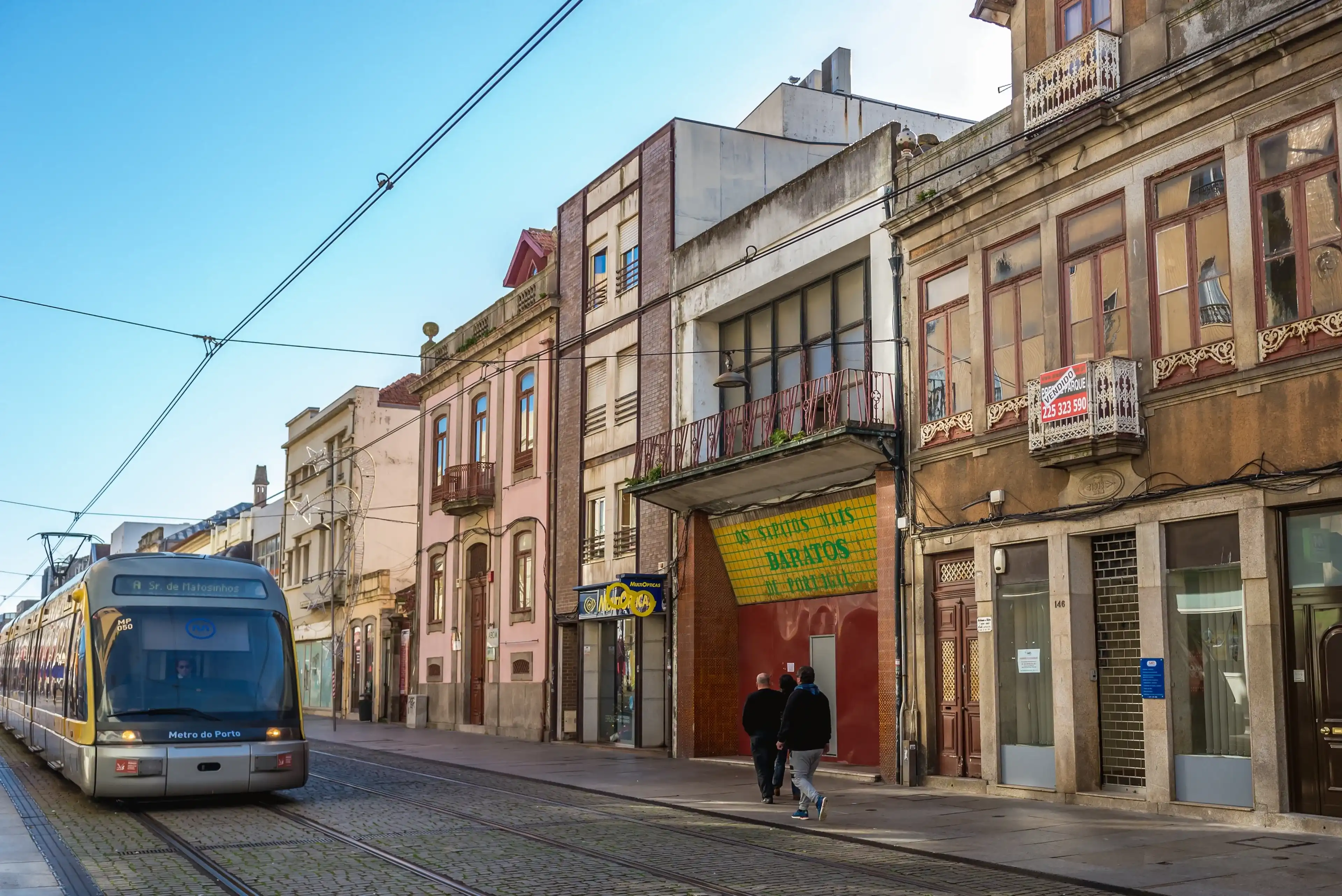 Matosinhos, Portugal - December 9, 2016: Eurotram metro train on Brito Capelo street in Matosinhos Matosinhos, Portugal - December 9, 2016: Eurotram metro train on Brito Capelo street in Matosinhos
