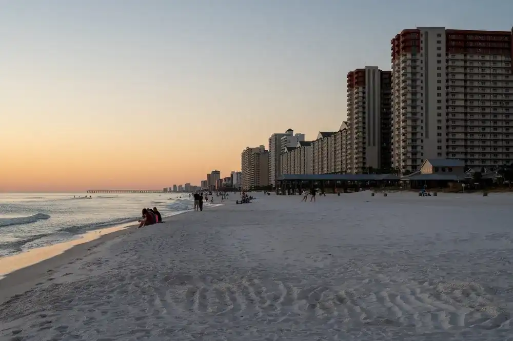 Panama City Beach, Florida - November 3, 2023 - Beach and beachfront residential buildings in evening twilight on cloudless autumn afternoon. Panama City Beach, Florida - November 3, 2023 - Beach and beachfront residential buildings in evening twilight on cloudless autumn afternoon.