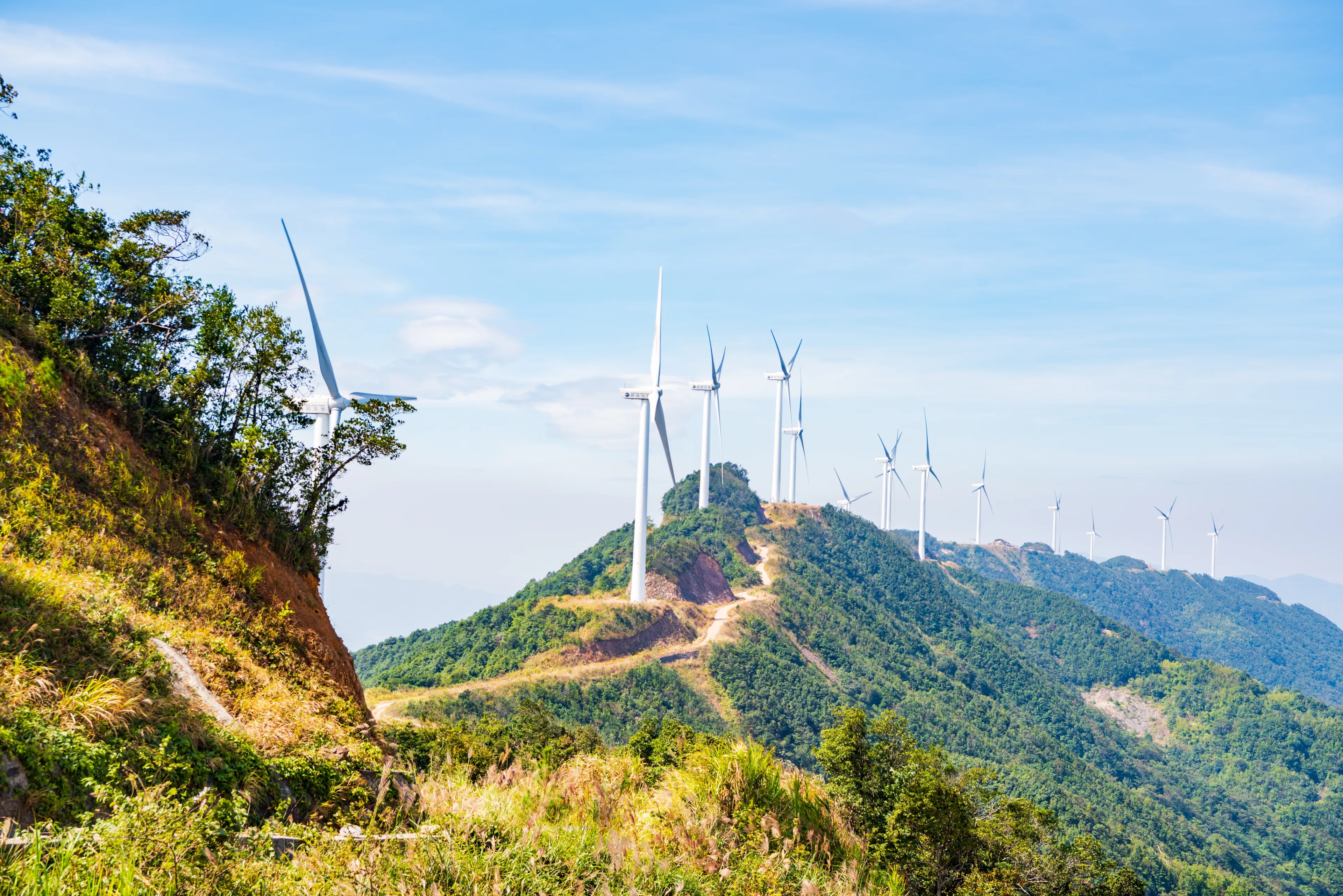 Windmills at Queya Mountain in Dongyuan County, Heyuan City, Guangdong Province, China on a sunny autumn day