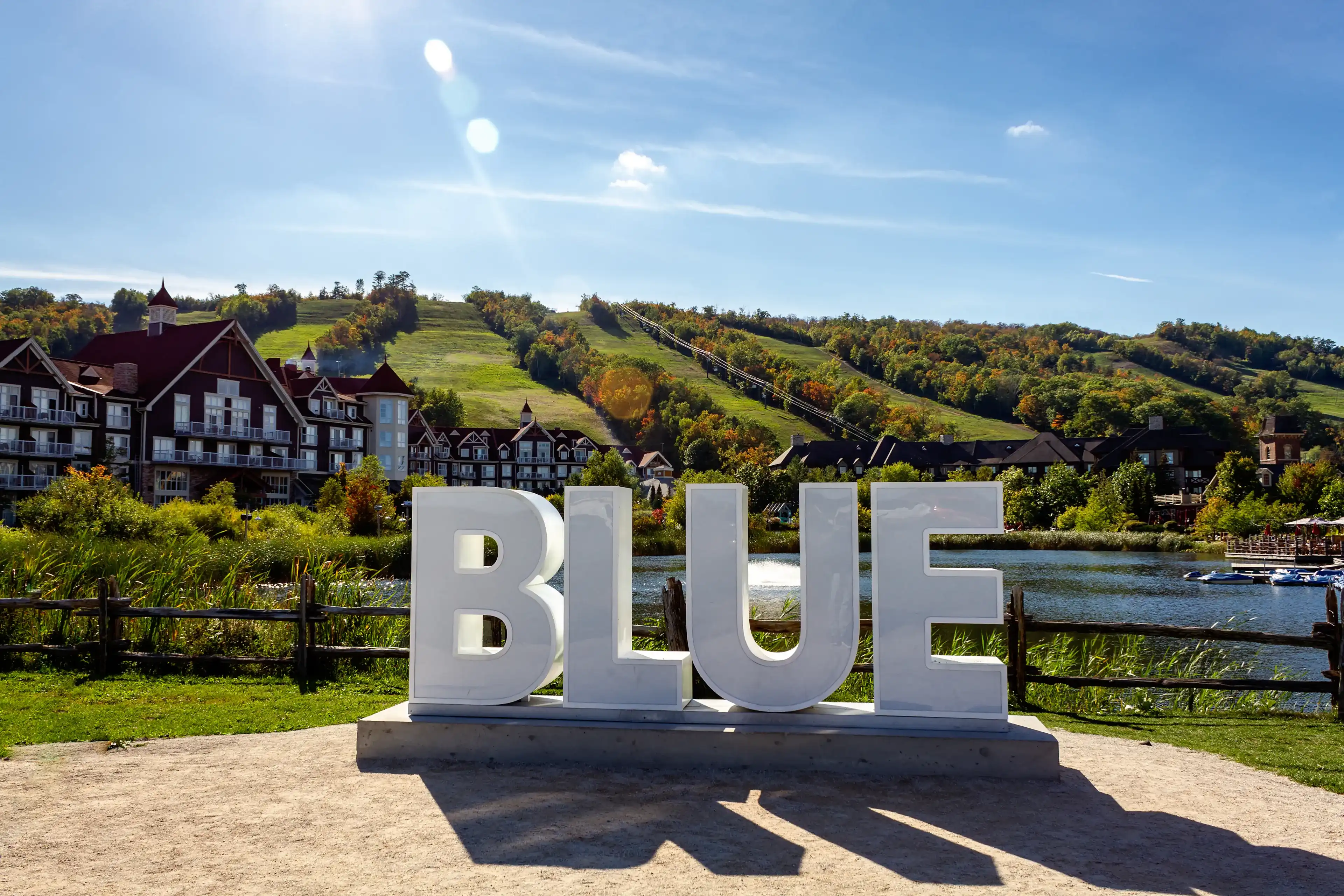 View of Mill pond and and BLUE sign, Blue Mountains Village, Ontario, Canada View of Mill pond and and BLUE sign, Blue Mountains Village, Ontario, Canada