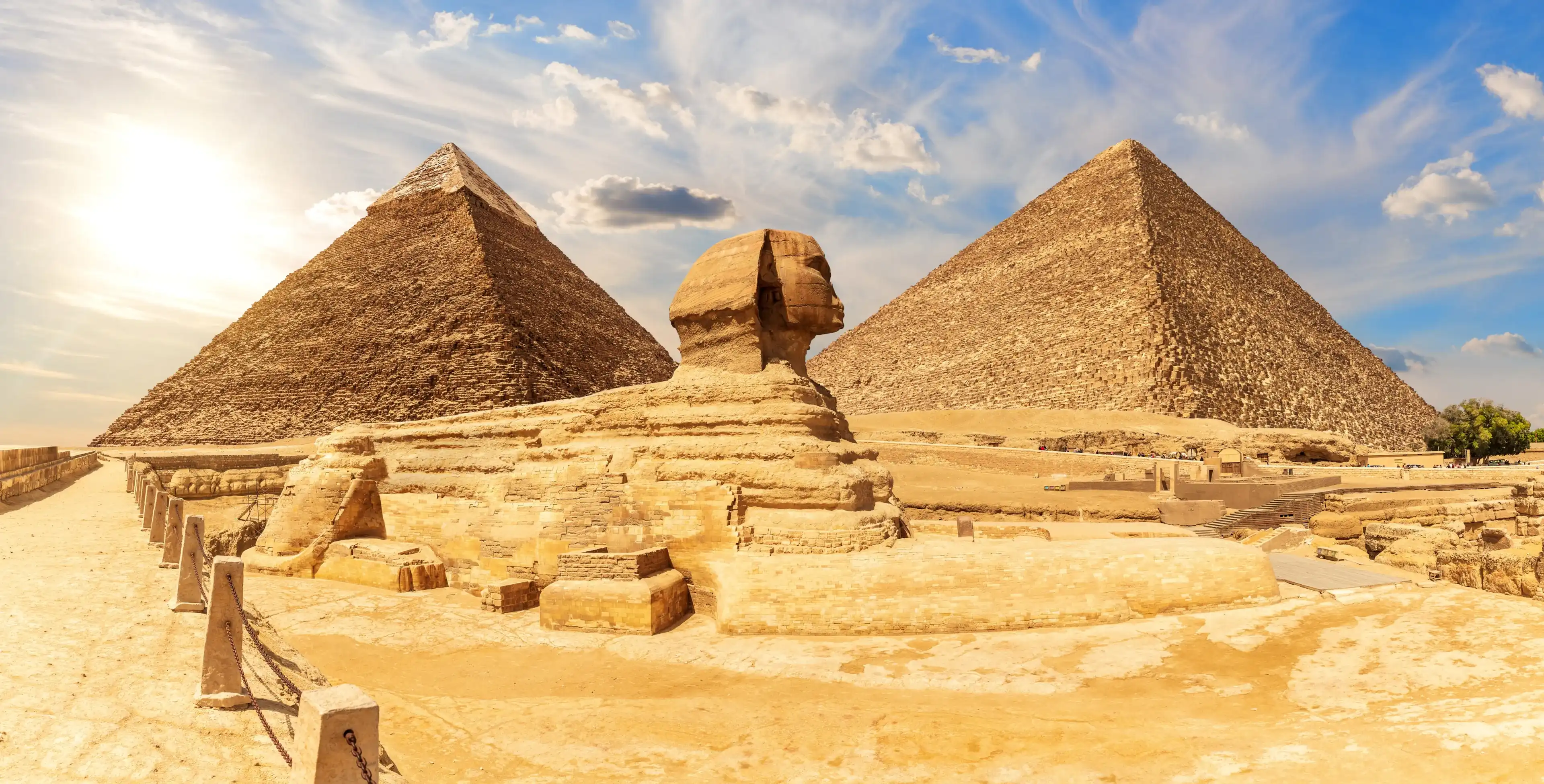The Sphinx in front of Pyramids of Egypt, beautiful panoramic view The Sphinx in front of Pyramids of Egypt, beautiful panoramic view