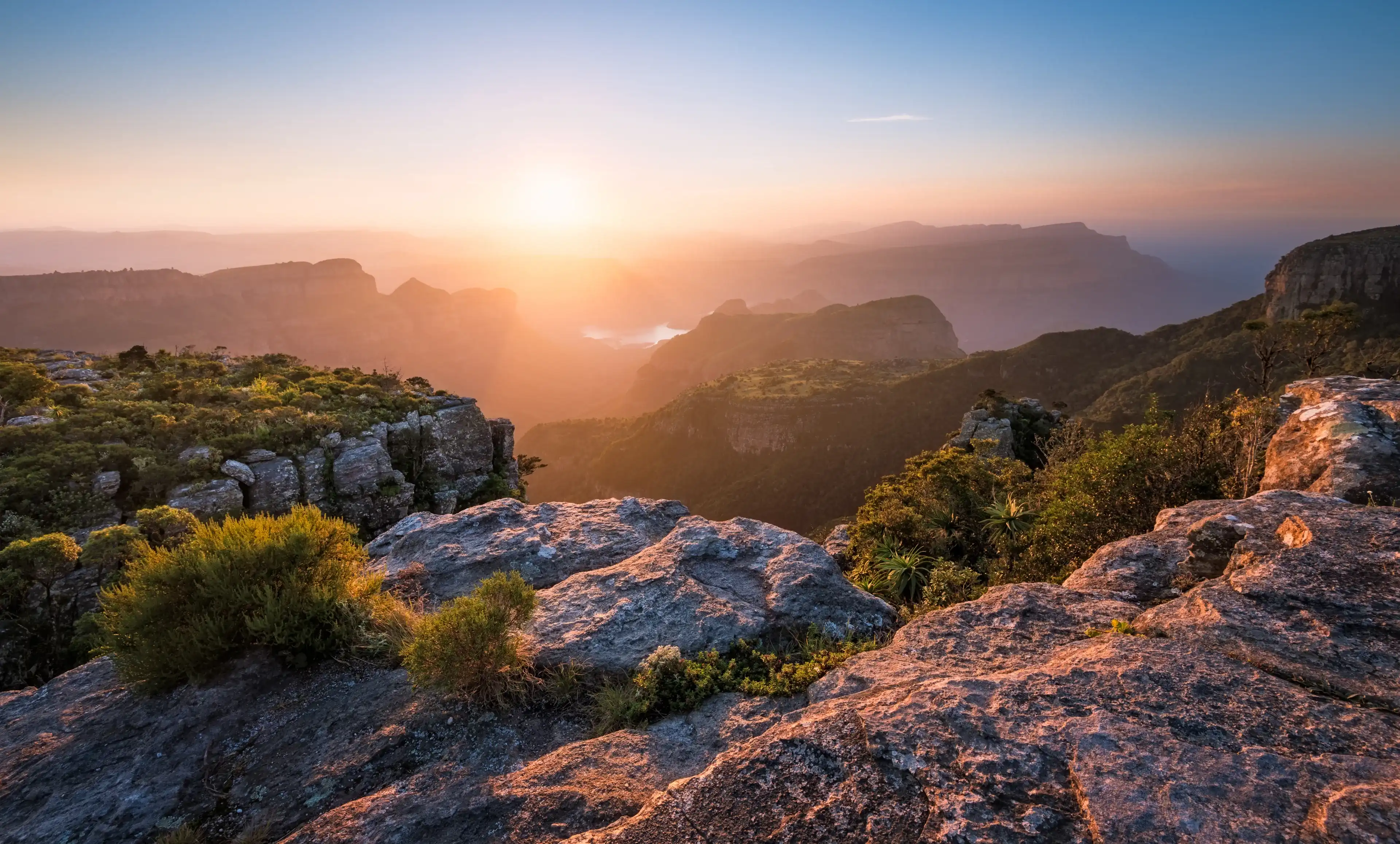 A horizontal photograph of a beautiful sunset over the Blyde River Canyon taken from Mariepskop A horizontal photograph of a beautiful sunset over the Blyde River Canyon taken from Mariepskop