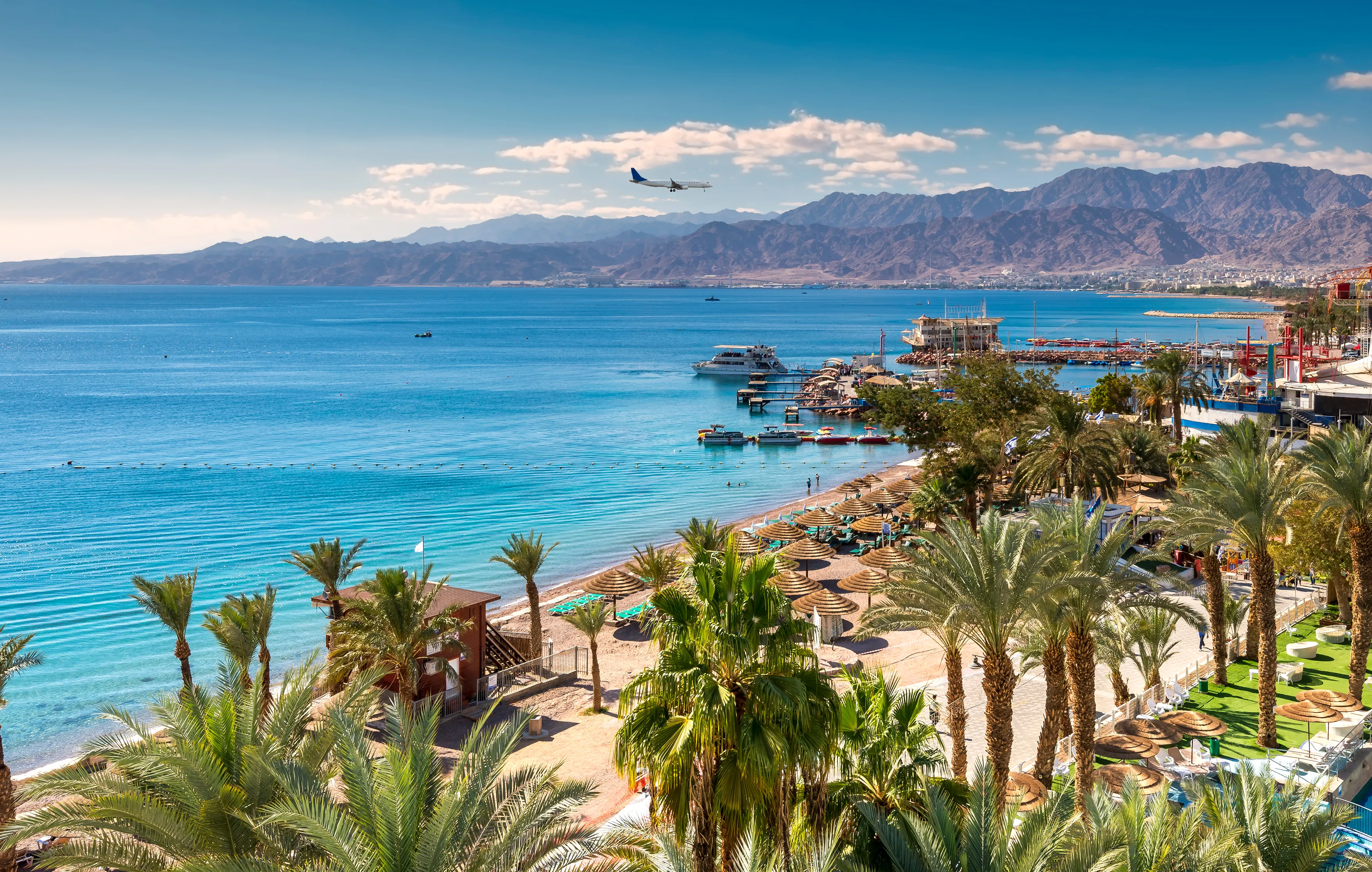 Central beach and marina in Eilat - famous resort and recreation city in Israel. This serene location is a very popular tropical getaway for Israeli and European tourists. 