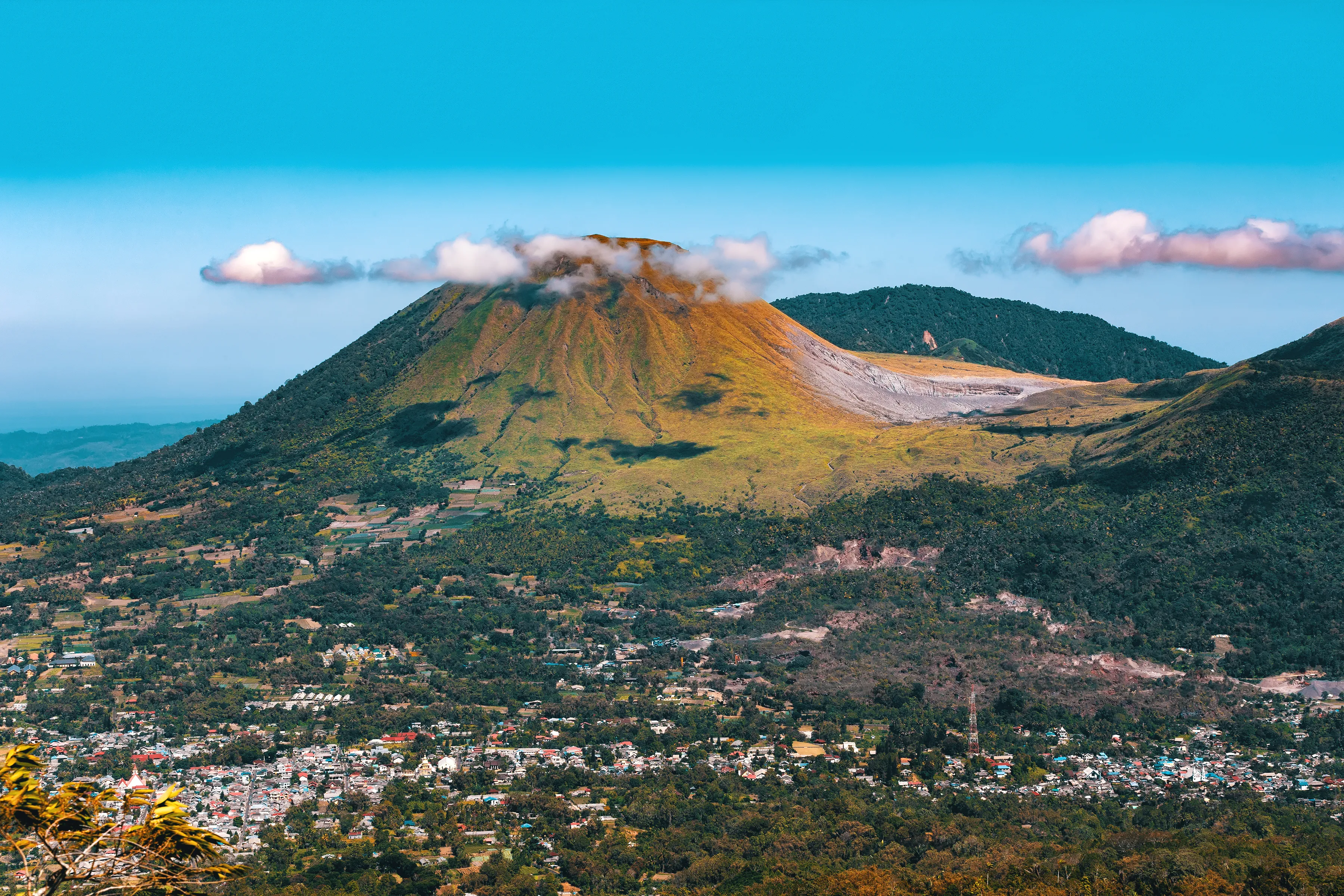 View from Mahawu volcano on the island of Sulawesi in Indonesia has a tiny crater lake. This part of the western Pacific has numerous live volcanoes