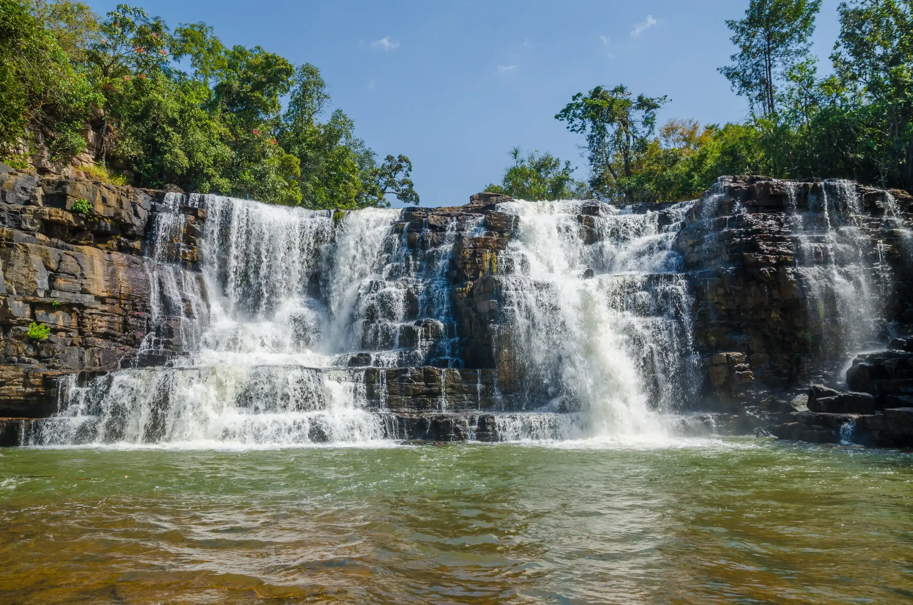 Beautiful Sala water falls near Labe with trees, green pool and a lot of water flow, Guinea Conakry, West Africa Beautiful Sala water falls near Labe with trees, green pool and a lot of water flow, Guinea Conakry, West Africa