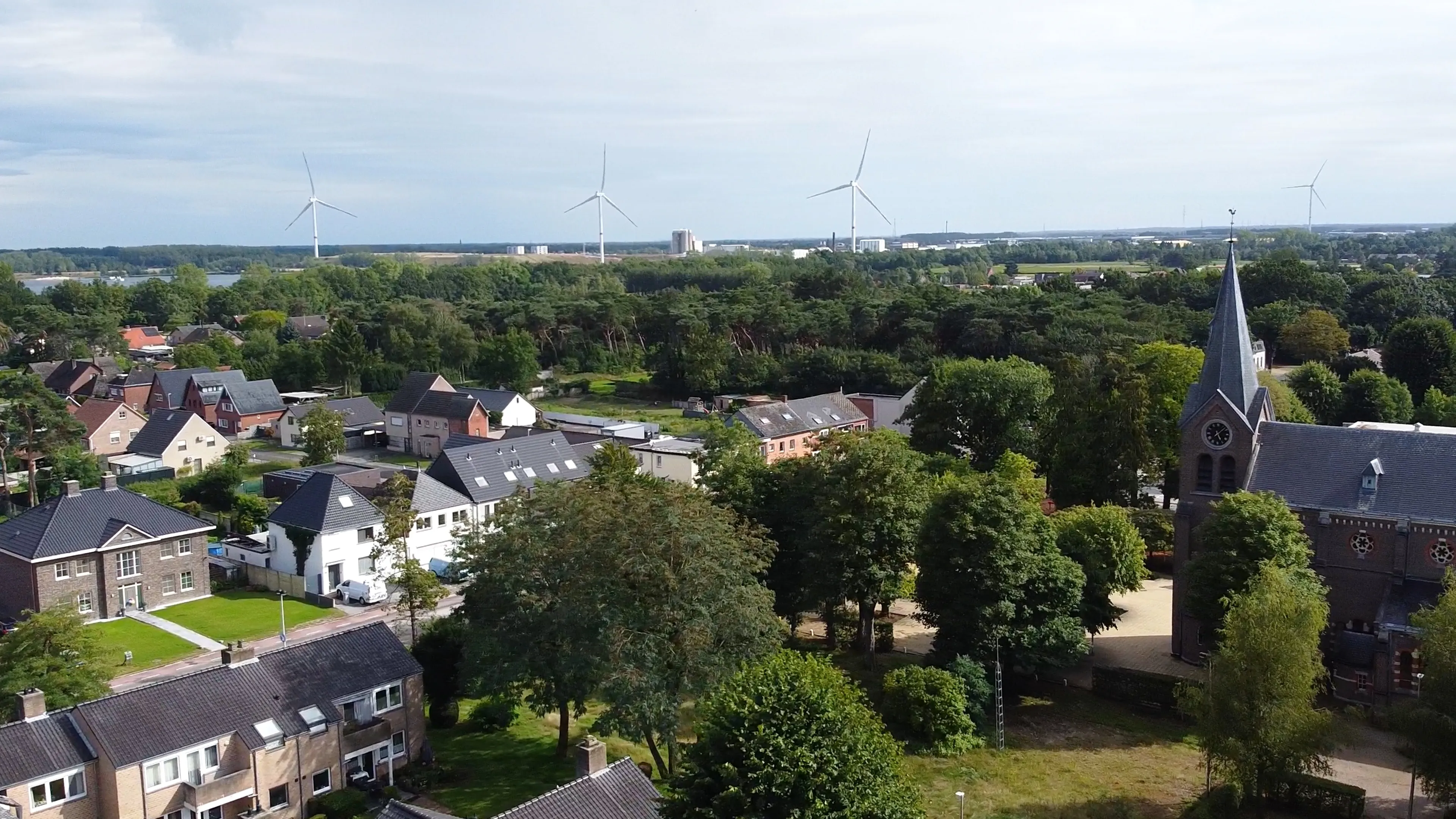 Aerial photo view of small village with a church in Belgium.