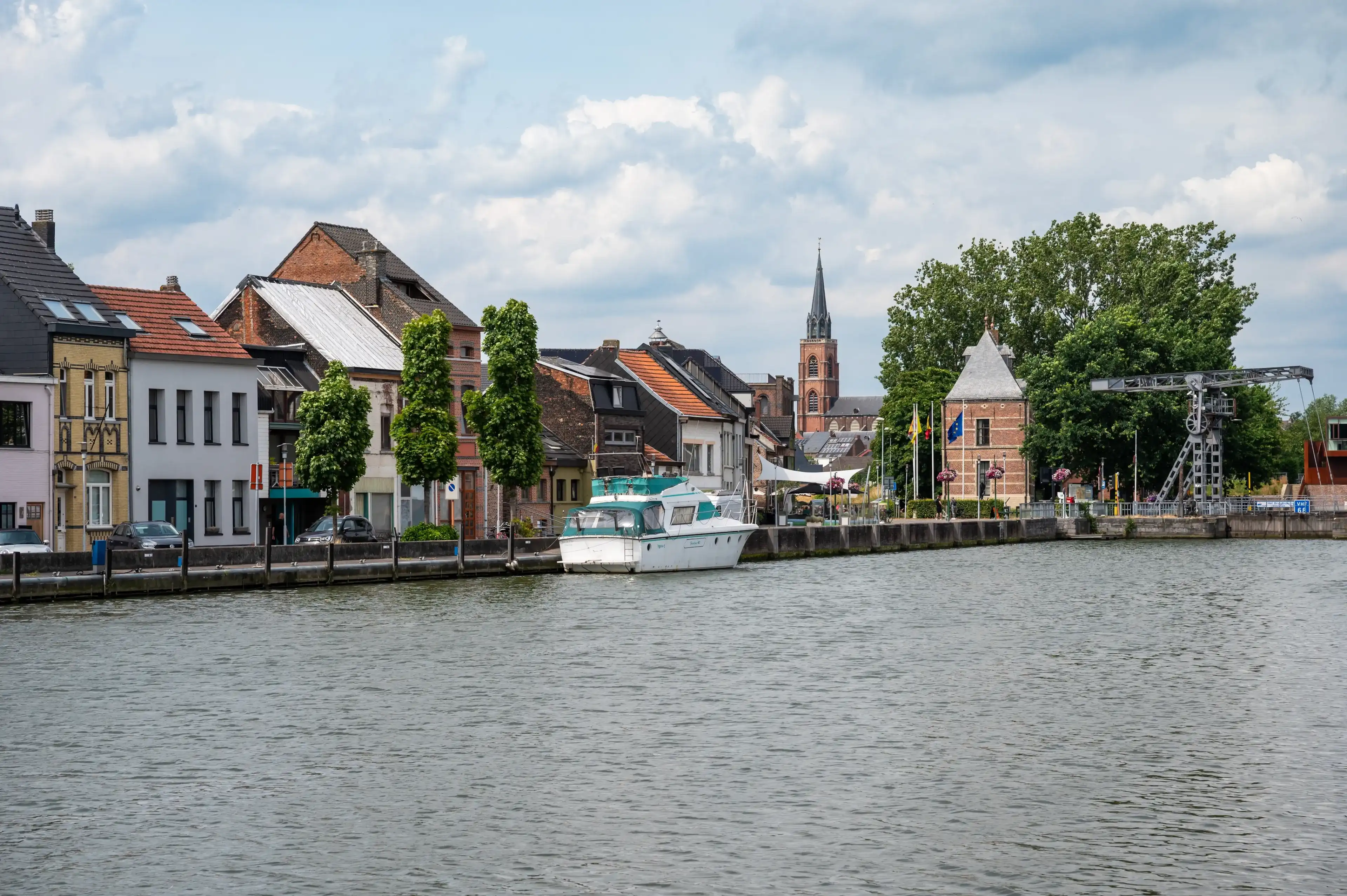 Willebroek, Antwerp Province, Belgium, June 30, 2023 - View over the village and boats at the banks of the canal Willebroek, Antwerp Province, Belgium, June 30, 2023 - View over the village and boats at the banks of the canal