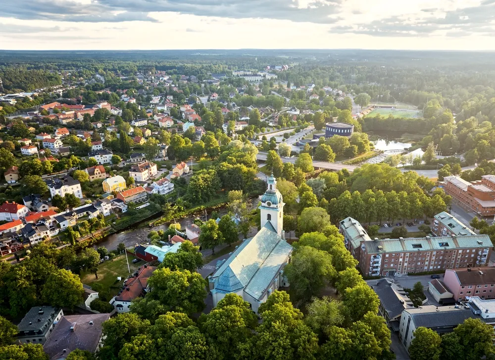 Aerial view of Gävle Holy Trinity Church (Heliga trefaldighets kyrka in Swedish) with Gävle concert hall in background.