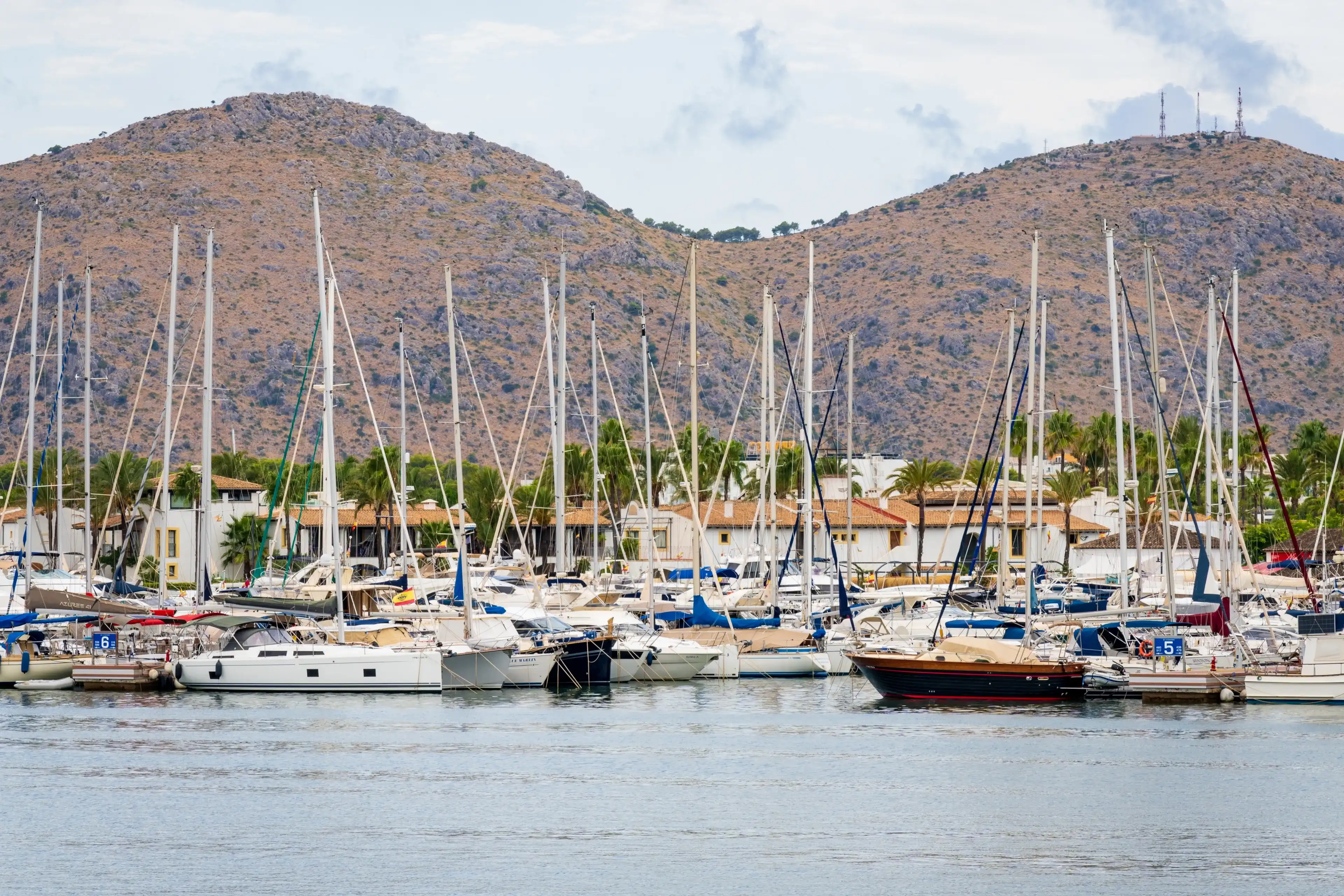 Alcudia, Spain - Aug 26, 2022: Port d’Alcúdia is a famous holiday destination on the northeast coast of Mallorca in Spain. Alcudia, Spain - Aug 26, 2022: Port d’Alcúdia is a famous holiday destination on the northeast coast of Mallorca in Spain.