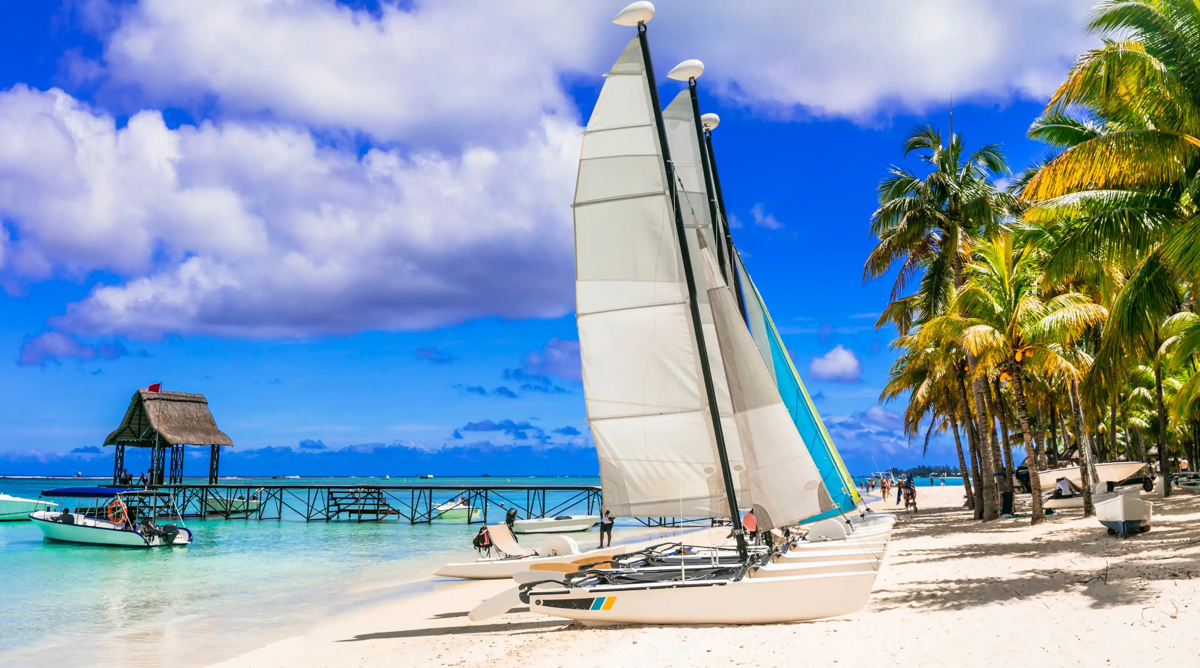 Water sport activities in beautiful tropical beach Trou aux Biches in Mauritius island. tropical holidays Water sport activities in beautiful tropical beach Trou aux Biches in Mauritius island. tropical holidays