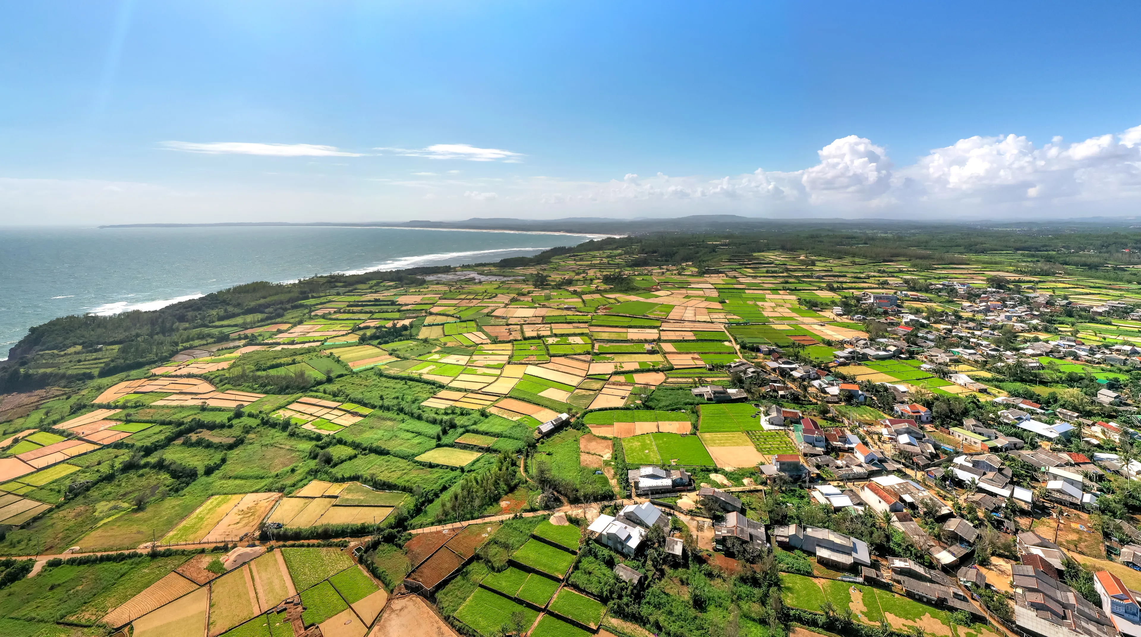 A panoramic view of the fields by the sea in Tinh Khe commune, Binh Son district, Quang Ngai province, Vietnam. View from above