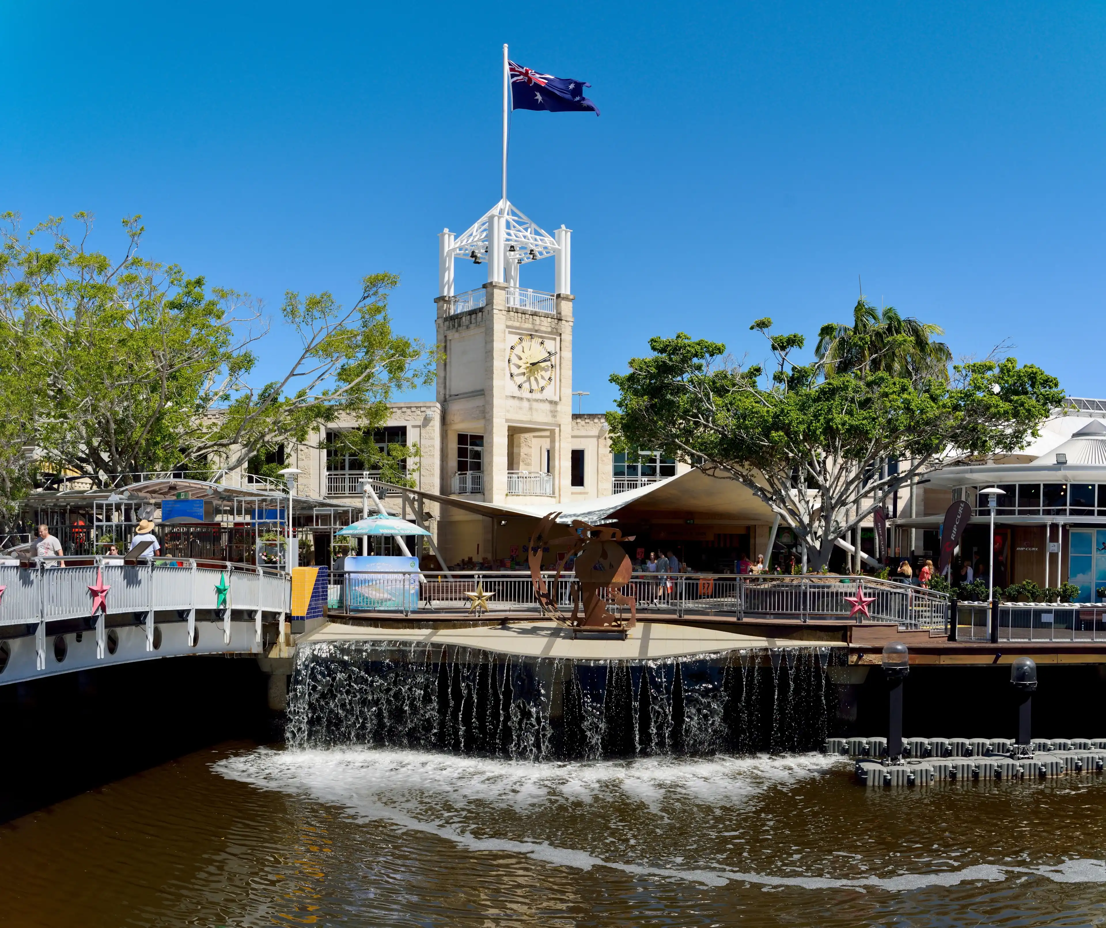 Maroochydore, Queensland, Australia - December 15, 2017. Street view in Maroochydore, with Sunshine Plaza, commercial properties, artificial waterfall and people. Maroochydore, Queensland, Australia - December 15, 2017. Street view in Maroochydore, with Sunshine Plaza, commercial properties, artificial waterfall and people.