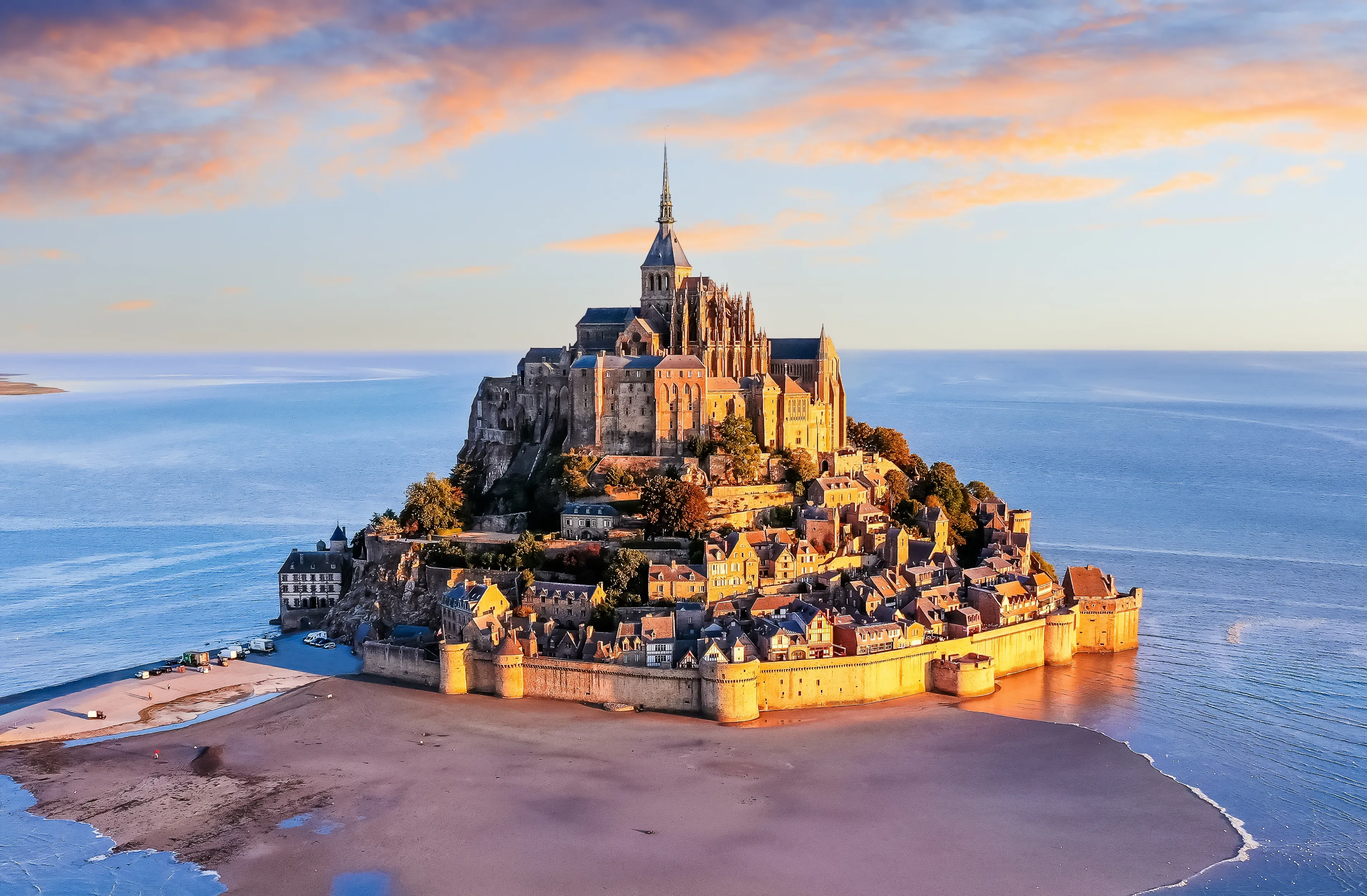 Mont Saint-Michel. Aerial view from the southeast during sunrise. Normandy, France.