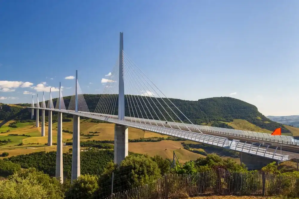 Multi-span cable stayed Millau Viaduct across gorge valley of Tarn River, Aveyron Departement, France Multi-span cable stayed Millau Viaduct across gorge valley of Tarn River, Aveyron Departement, France