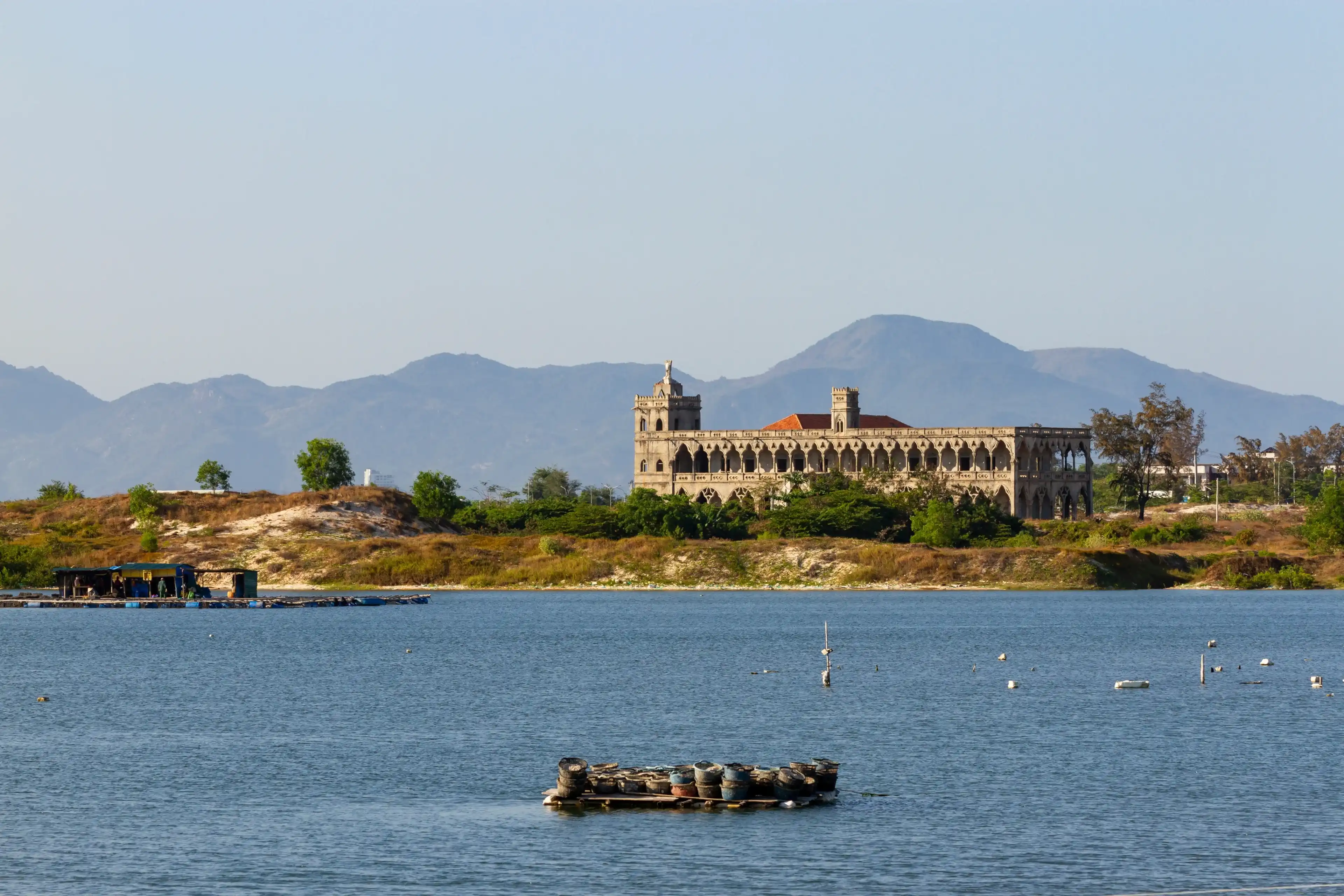 Beautiful Landscape Of A Old Catholic Monastery With Lake And Mountains In Cam Ranh, Vietnam. Beautiful Landscape Of A Old Catholic Monastery With Lake And Mountains In Cam Ranh, Vietnam.
