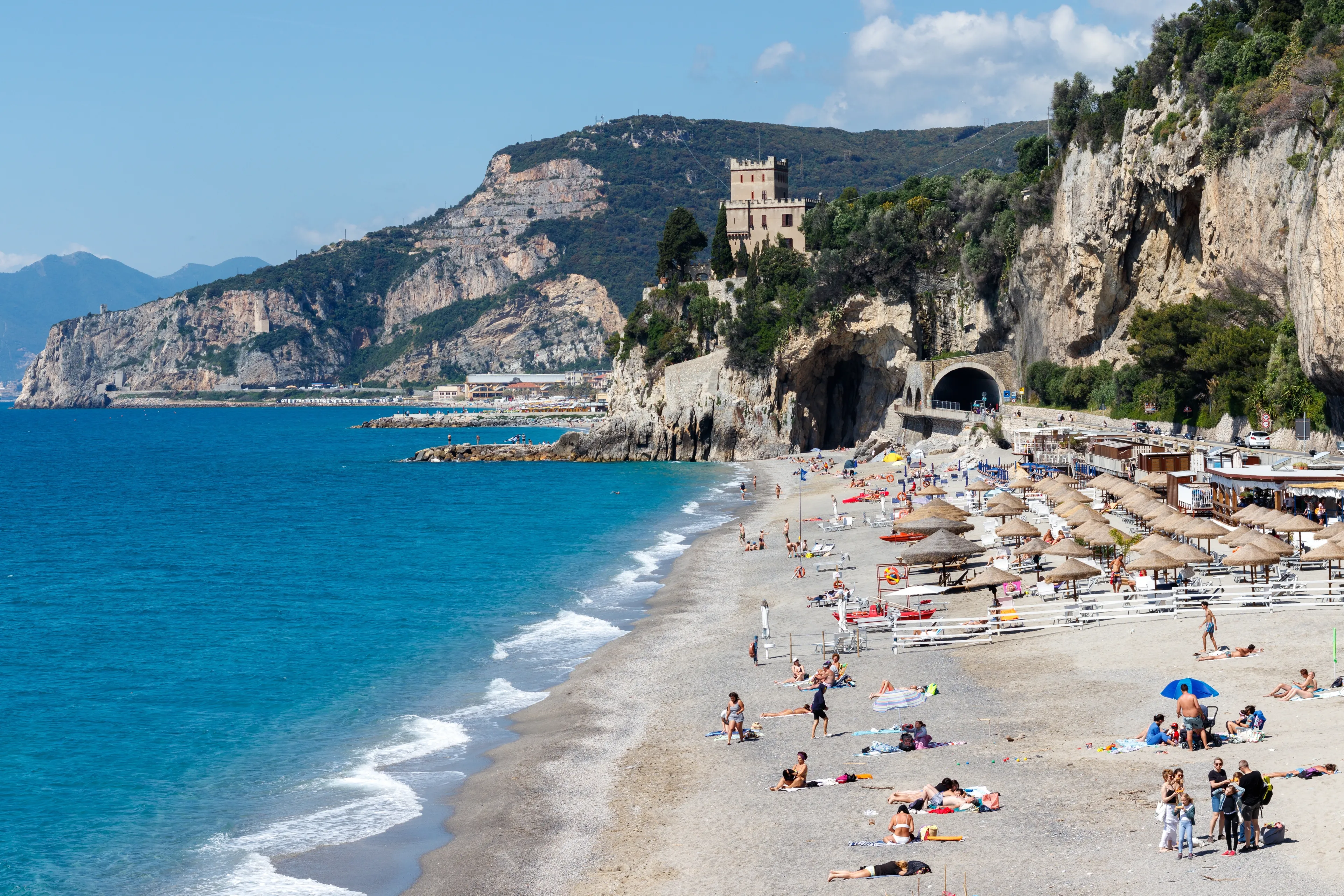 Finale ligure, italy, 17.05.2024: View of finale ligure beach under castelletto in early summer