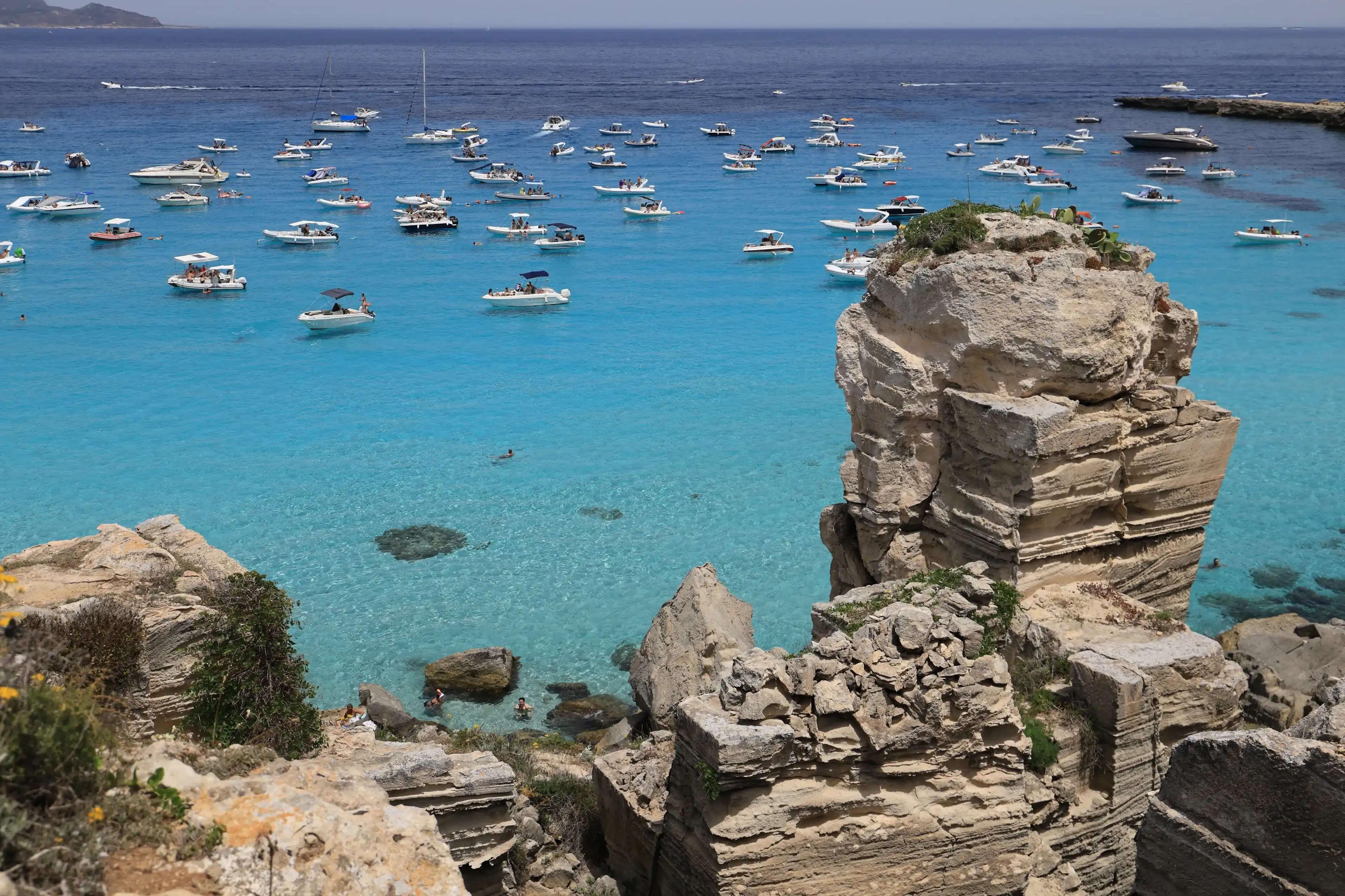 Favignana, Italy - June 2, 2024: Shore of Cala Rossa, one of the beautiful bays in Favignana in Sicily Favignana, Italy - June 2, 2024: Shore of Cala Rossa, one of the beautiful bays in Favignana in Sicily