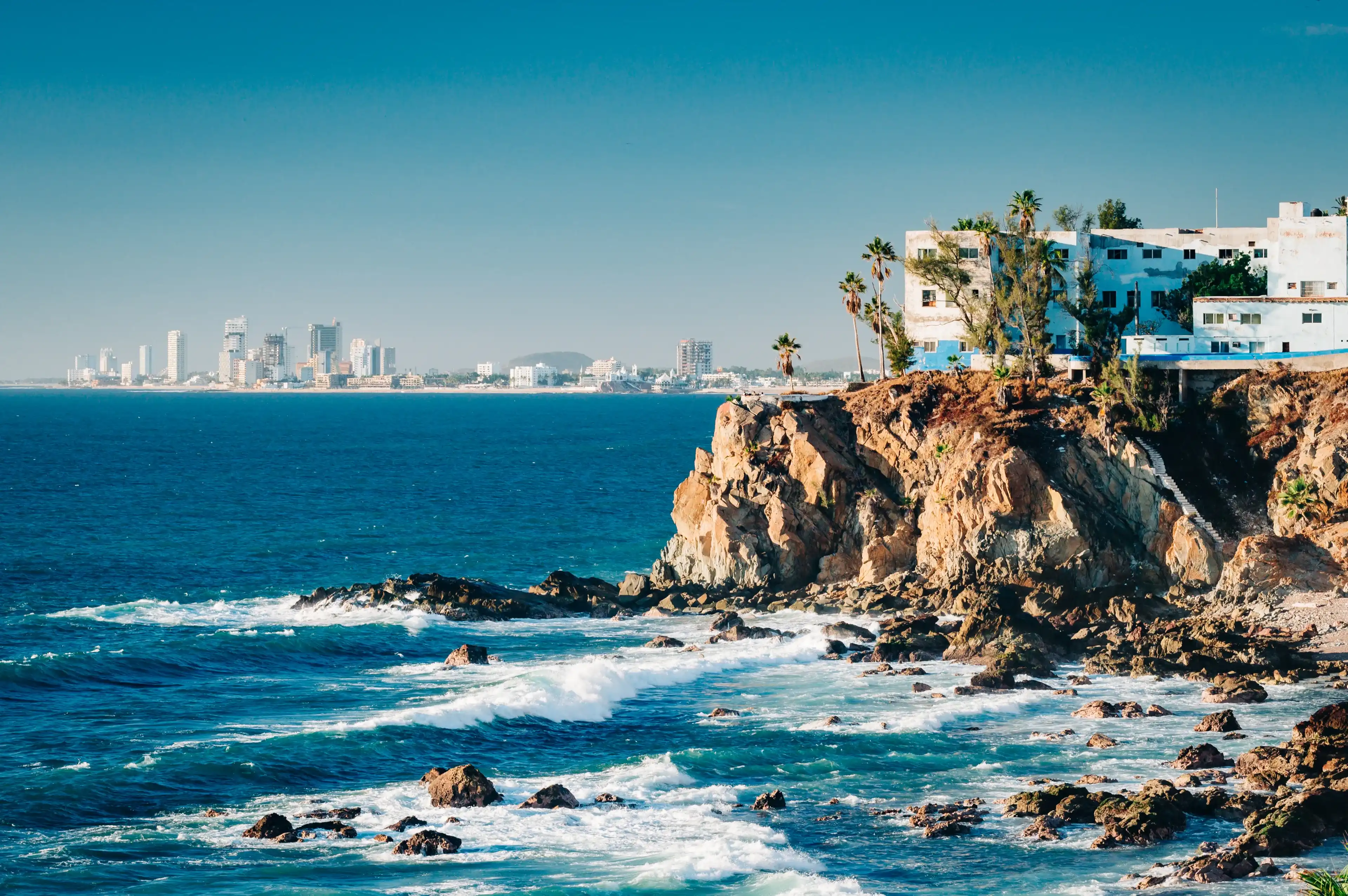 Mazatlan as seen from afar with a spectacular cliff line in the foreground Mazatlan as seen from afar with a spectacular cliff line in the foreground