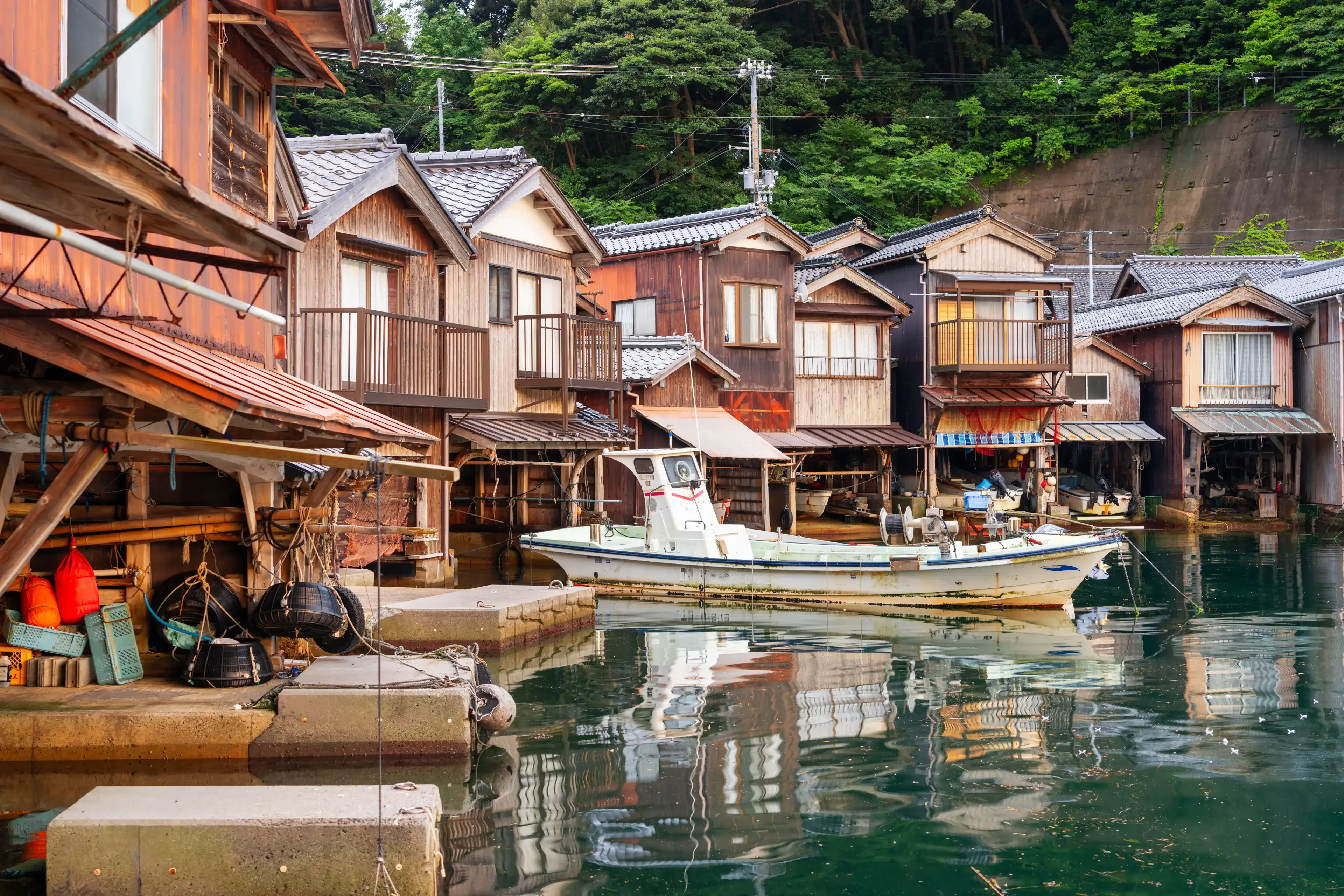 Kyoto, Japan at Ine Bay historic funaya boathouses at dusk. Kyoto, Japan at Ine Bay historic funaya boathouses at dusk.