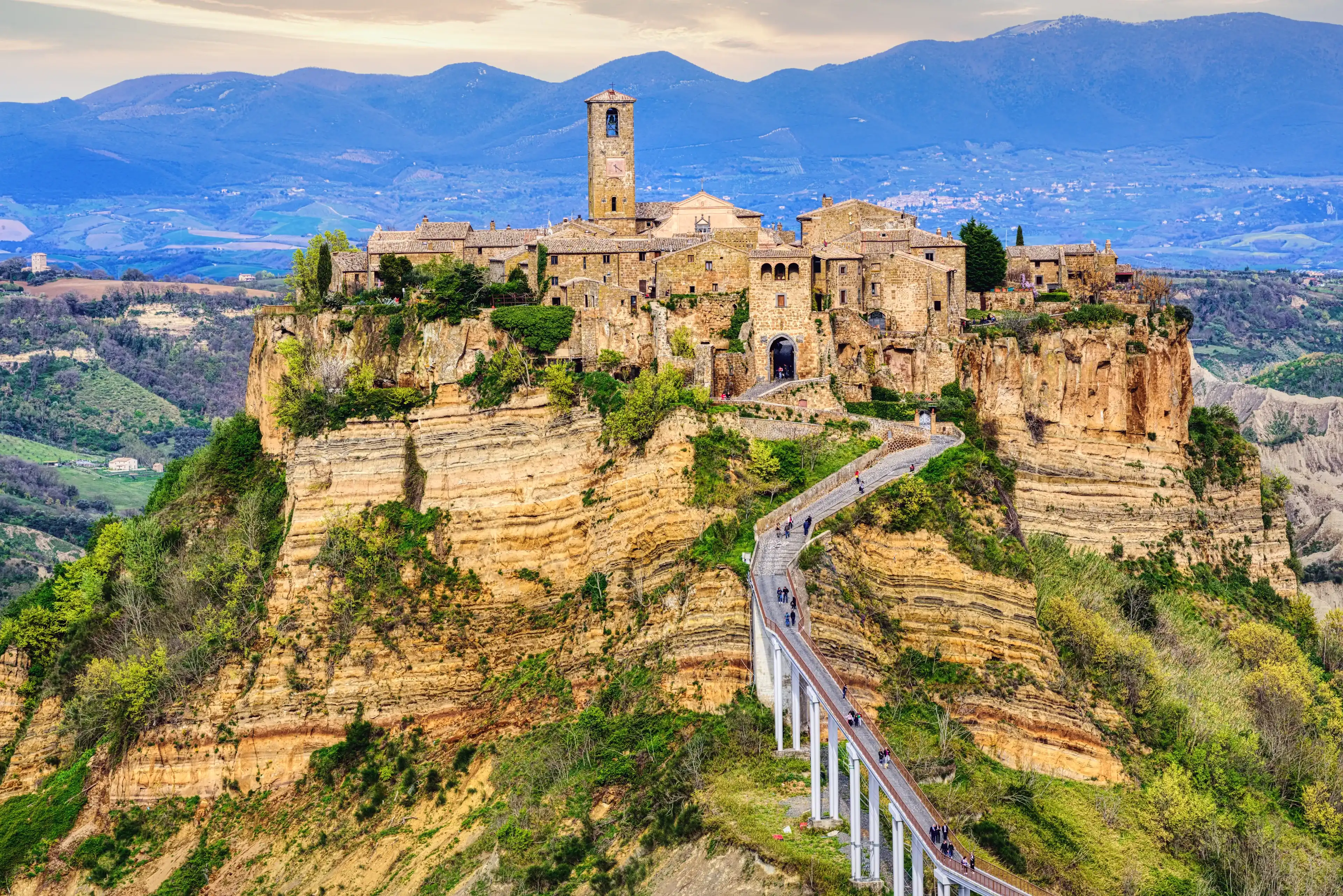 Civita di Bagnoregio, a picturesque hilltop village in Italy, is a popular day trip destination from Rome Civita di Bagnoregio, a picturesque hilltop village in Italy, is a popular day trip destination from Rome