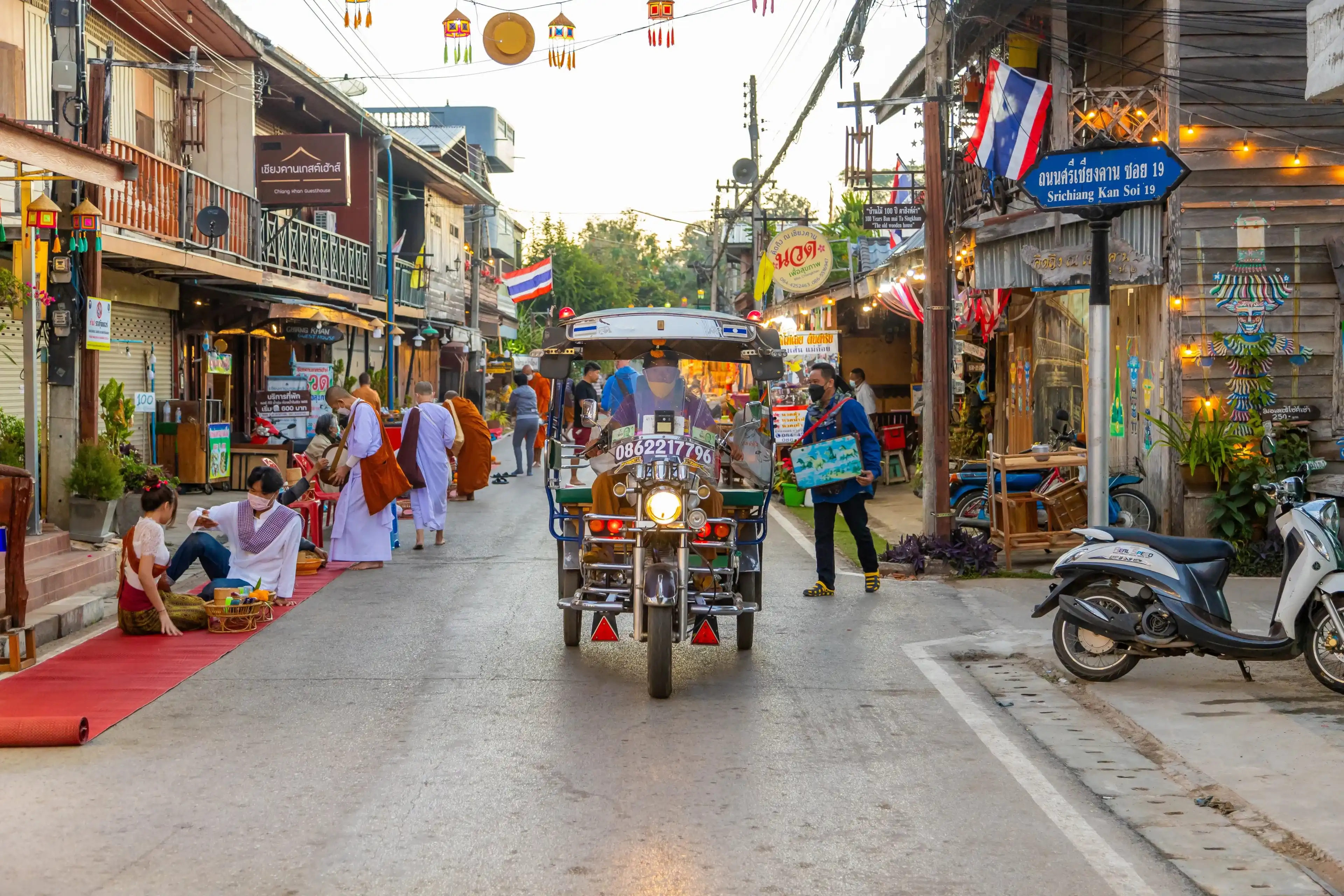 Loei province, Thailand Dec 27, 2021 Tourist group On Chiang Khan Walking Street Chiang Khan District, Loei Province Thailand Loei province, Thailand Dec 27, 2021 Tourist group On Chiang Khan Walking Street Chiang Khan District, Loei Province Thailand