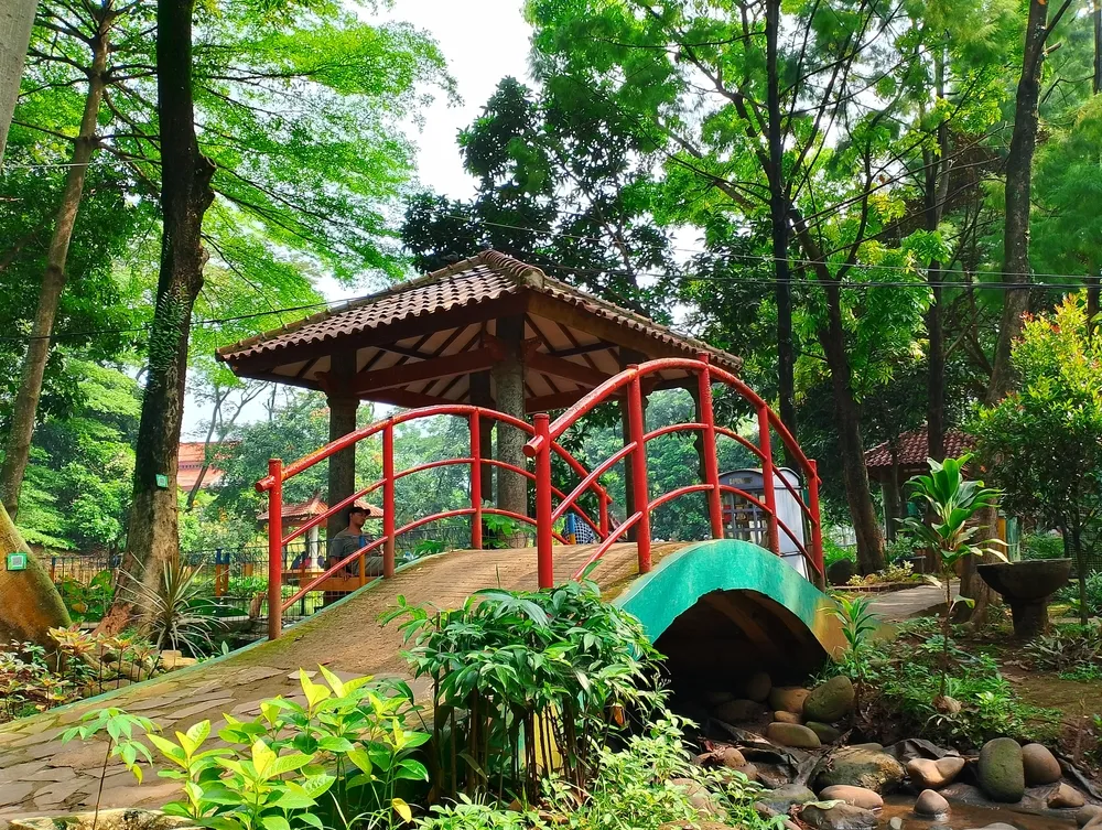 Depok, West Java, Indonesia - May 23, 2024: Small bridge in a public park in Depok, West Java, Indonesia