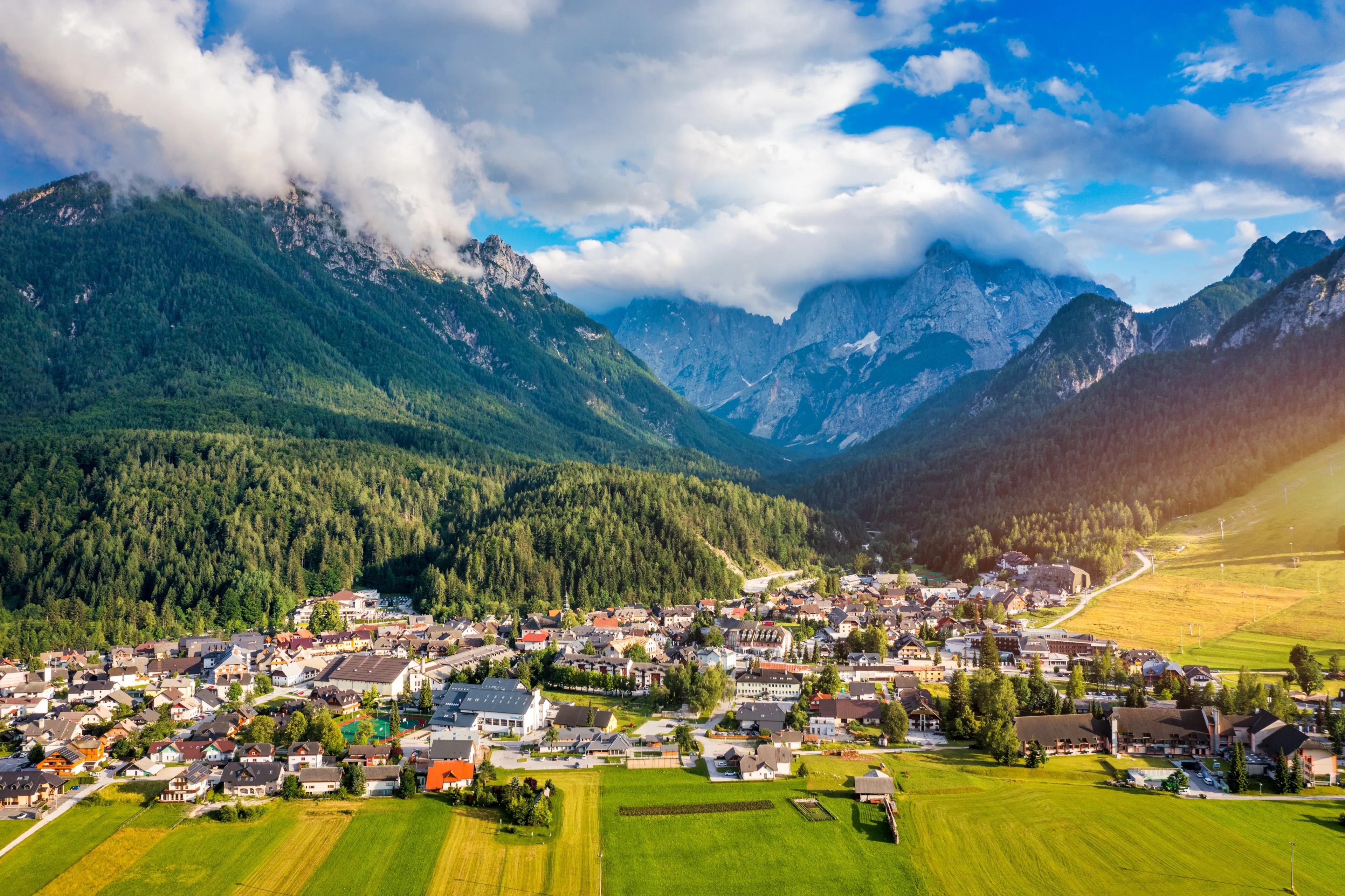 Kranjska Gora town in Slovenia at summer with beautiful nature and mountains in the background. View of mountain landscape next to Kranjska Gora in Slovenia, view from the top the town Kranjska Gora.